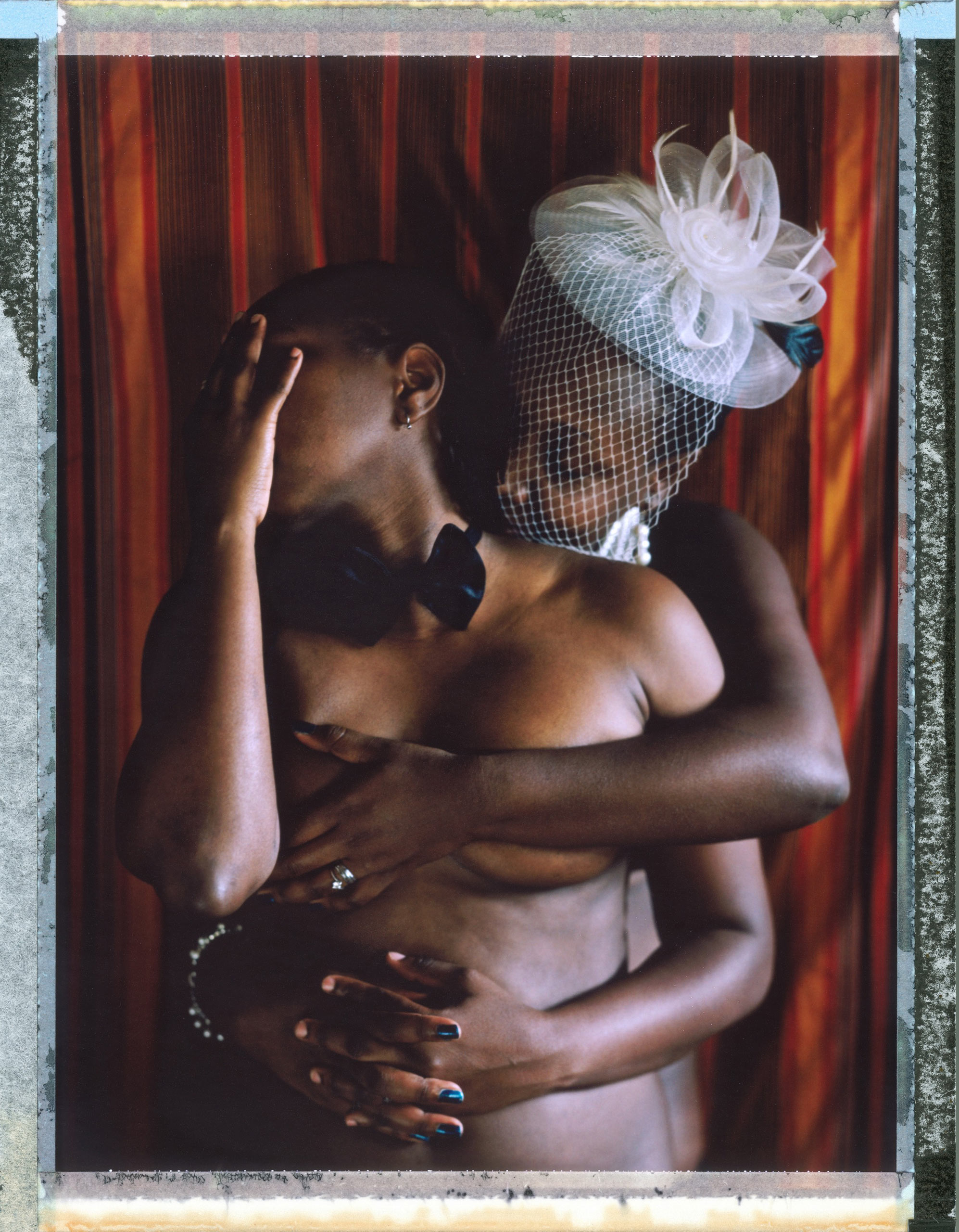 A posed posed portrait of “J” and “Q” who are too afraid to reveal their identities. They describe the circumstances they find themselves in: “(we) are a lesbian married couple though not recognized because in Uganda society lesbianism as an abnormality, an outcast, a disease that needs to be cured… We have been attacked verbally by people (men) who have noticed we are a couple… “you need to be raped to rid of your stupidity of liking a fellow girl.”… We can’t publically we are married especially since the bill had been passed and thus caused more awareness and polluted very many Ugandans minds against the LGBTIQ community which has also made living in Uganda as a lesbian a dangerous thing.” Uganda, September 2014.  While many countries around the world are legally recognizing same-sex relationships, individuals in nearly 80 countries face criminal sanctions for private consensual relations with another adult of the same sex. Violence and discrimination based on sexual orientation or gender expression is even more widespread. Africa is becoming the worst continent for Lesbian, Gay, Bi-sexual, Transgender, Queer, Inter-sex (LGBTQI) individuals. More than two thirds of African countries have laws criminalizing consensual same-sex acts. In some, homosexuality is punishable by death. In Nigeria new homophobic laws introduced in 2013 led to dramatic increase in attacks. Under Sharia Law, homosexuality is punishable by death, up to 50 lashes and six months in prison for woman; for men elsewhere, up to 14 years in prison. Same sex acts are illegal in Uganda. A discriminatory law was passed then struck down and homophobic attacks rose tenfold after the passage of the Anti-Homosexuality Act. In Cameroon it is also illegal. More cases against suspected homosexuals are brought here than any other African country. In stark contrast with the rest of the continent, same sex relationships are legal in South Africa. The country has the most liberal laws towa