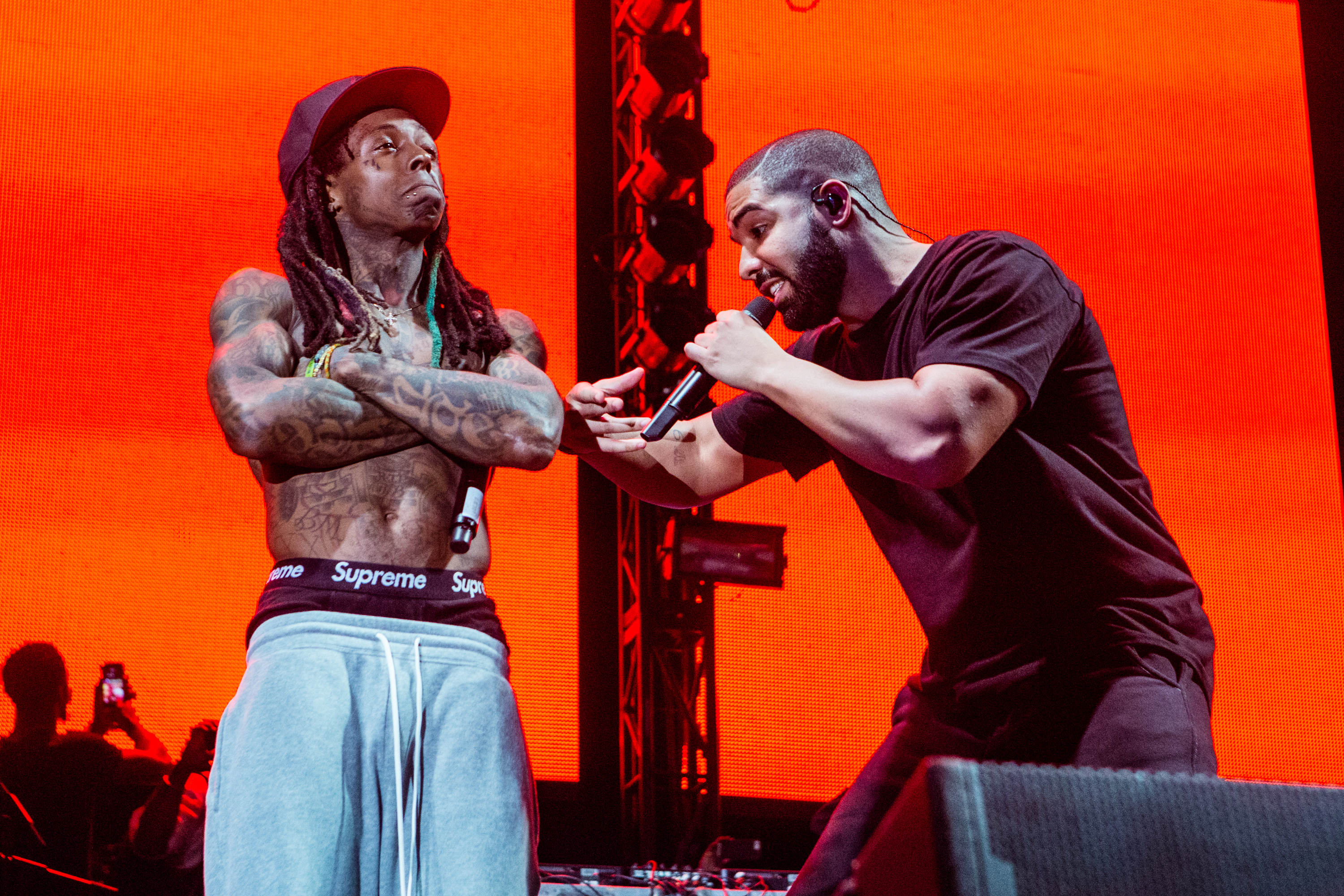 Lil Wayne and Drake perform at Lil Weezyana Festival at Champions Square on Aug. 28, 2015 in New Orleans. (Josh Brasted—WireImage/Getty Images)