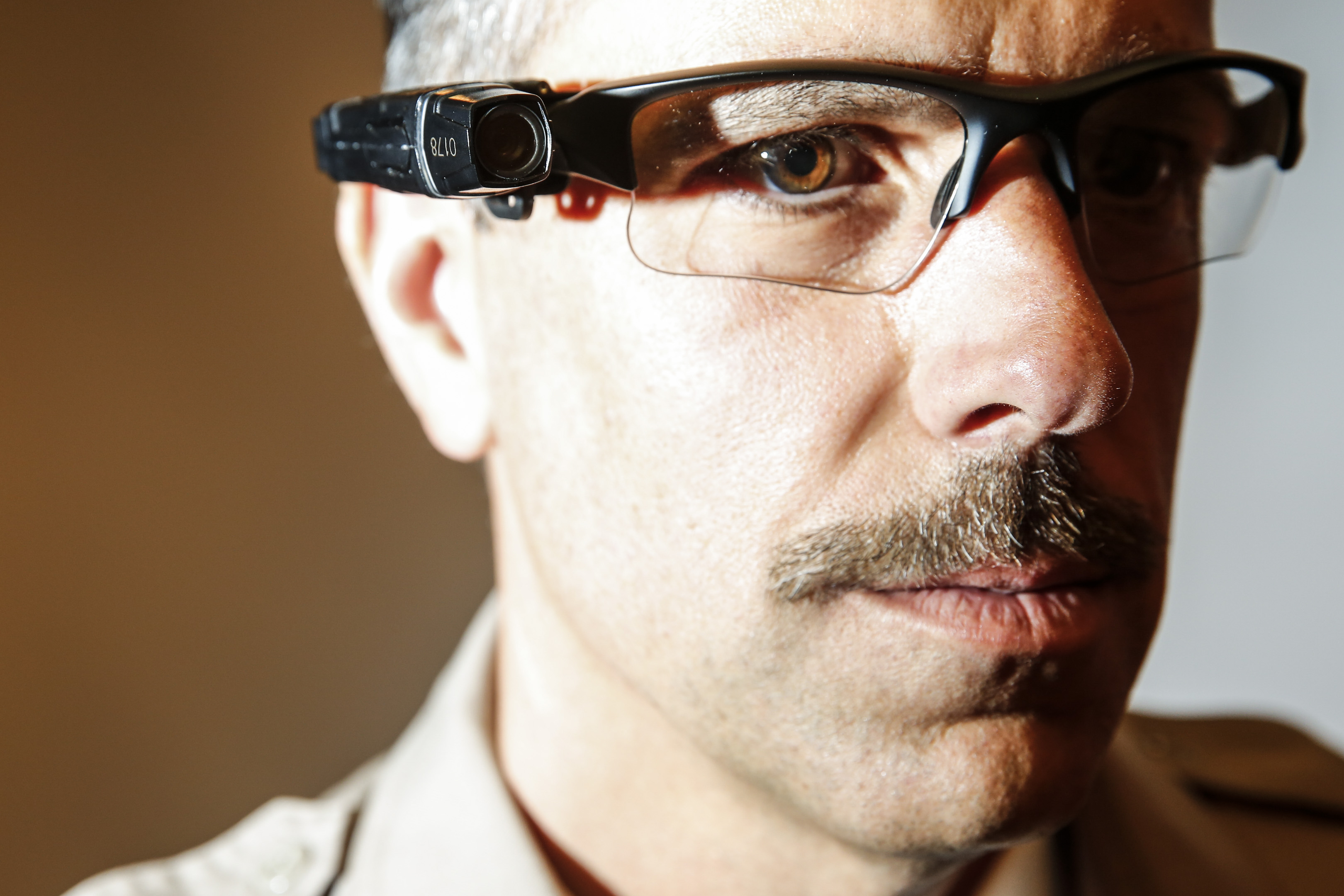 County of Los Angeles Sheriff's Lt. Chris Marks poses wearing the Taser Axon Flex, on-officer camera system attached to glasses in Monterey Park on Sept. 17, 2014. (Jay L. Clendenin—Los Angeles Times/Getty Images)
