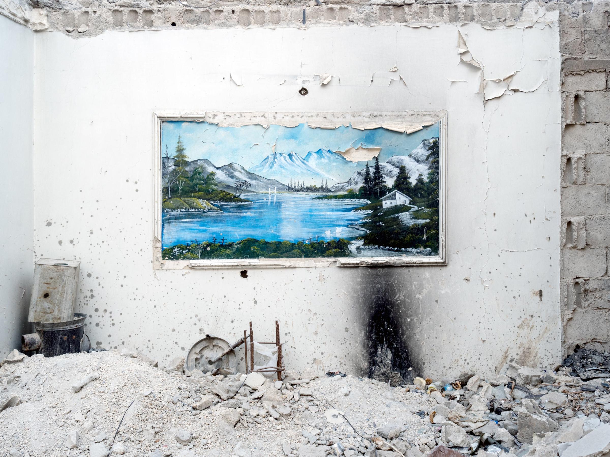 SYRIA. Kobani / Kobane (Arabic: Ayn al Arab) . 09 August 2015. A painting is seen inside a destroyed builiding.