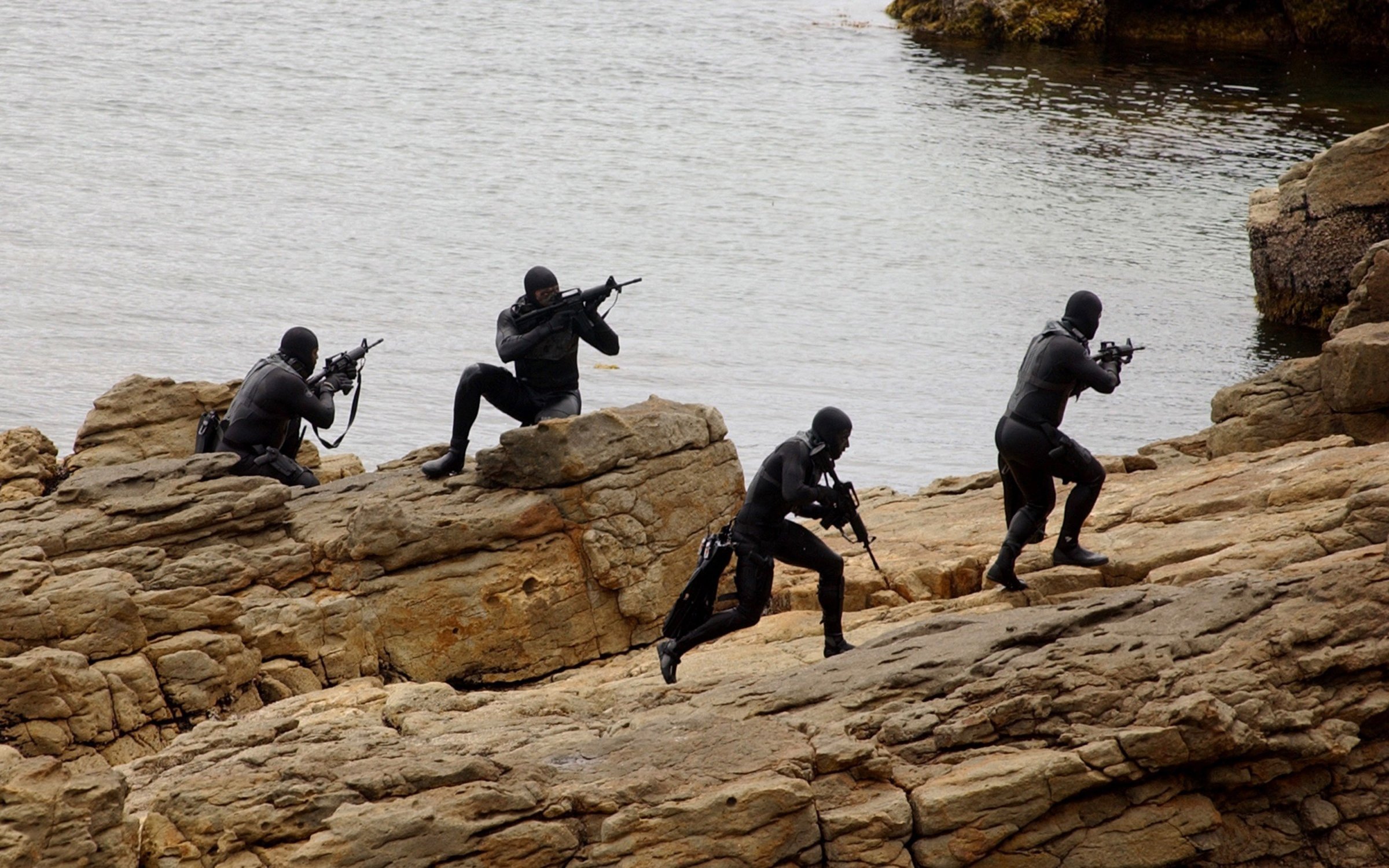 Navy SEALs practice Over The Beach evolutions during a training exercise on May 25, 2004 in a Remote Training Facility.