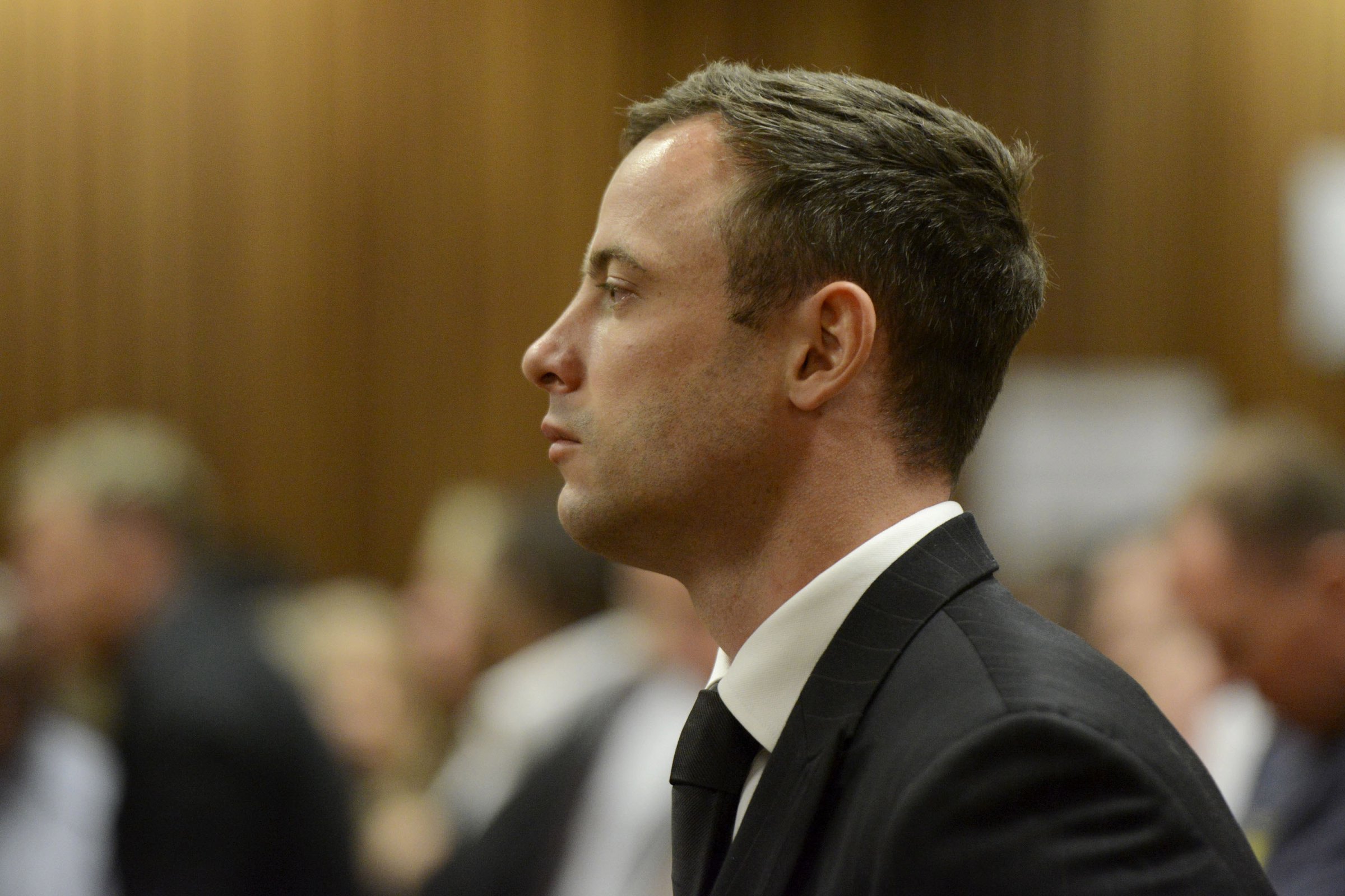 Oscar Pistorius listens to his judgement in the Pretoria High Court on October 21, 2014, in Pretoria, South Africa.