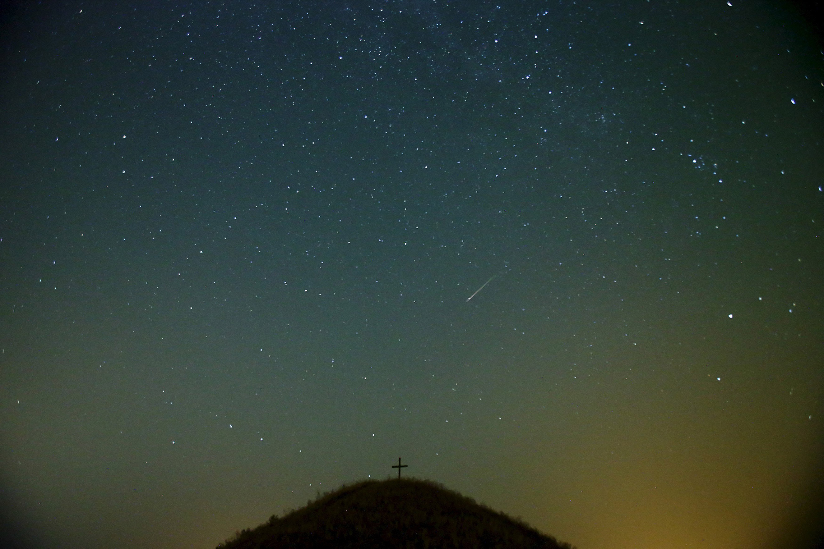 The Perseid meteor shower over Leeberg hill near Grossmugl, Austria on Aug. 13, 2015.