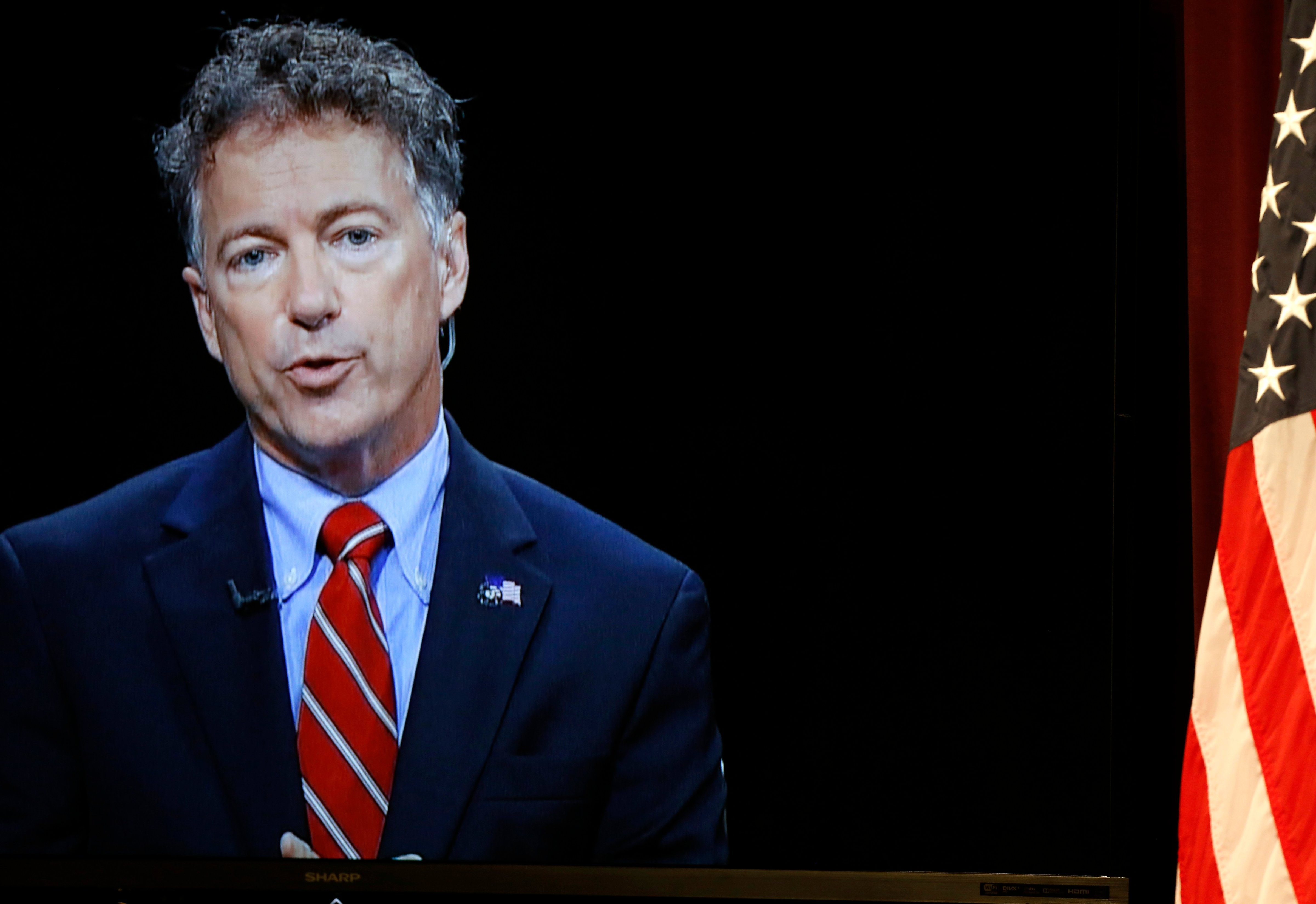 Republican presidential candidate, Sen. Rand Paul, R-Ky., shown on a video screen from C-SPAN's Washington studio, speaks during a forum on Aug. 3, 2015, in Manchester. (Jim Cole—AP)