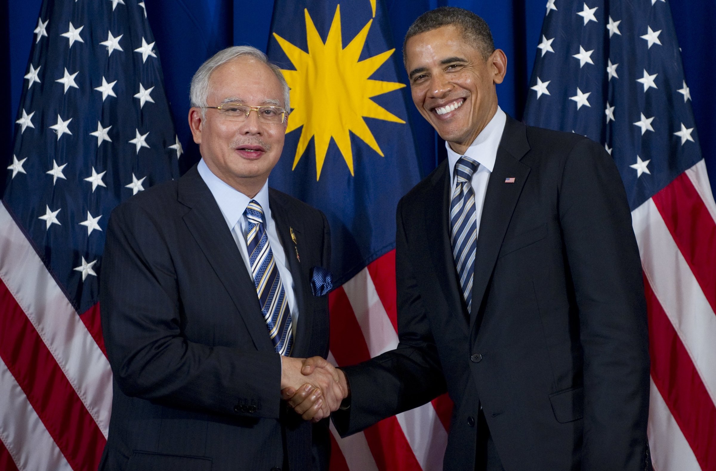 U.S. President Barack Obama shakes hands with Prime Minister Najib Razak of Malaysia during a meeting on the sidelines of the ASEAN and East Asia summits in Nusa Dua on Indonesia's resort island of Bali, on Nov. 18, 2011.