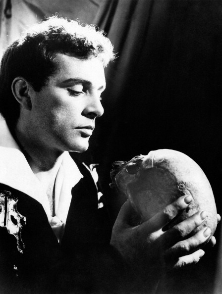 Wearing modern dress, Burton plays Hamlet at a booming pitch, virile and muscular yet bitter and sardonic. Directed by John Gielgud on a stark stage, the hit production gave Hamlet its longest Broadway run before becoming immortalized on film.