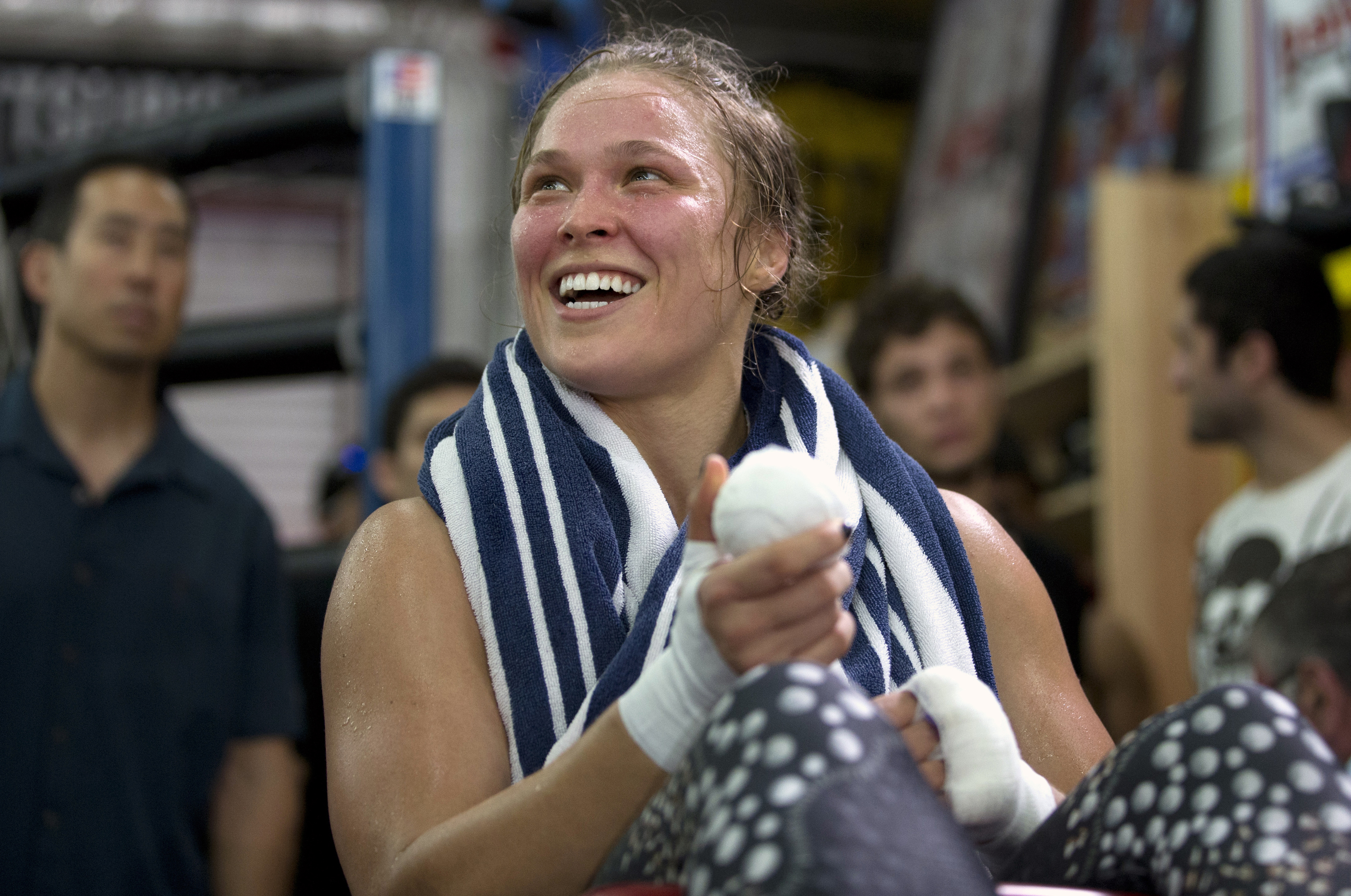 Mixed martial arts fighter Ronda Rousey smiles during her workout at Glendale Fighting Club, in Glendale, Calif. on July 15, 2015. (Jae C. Hong—AP)