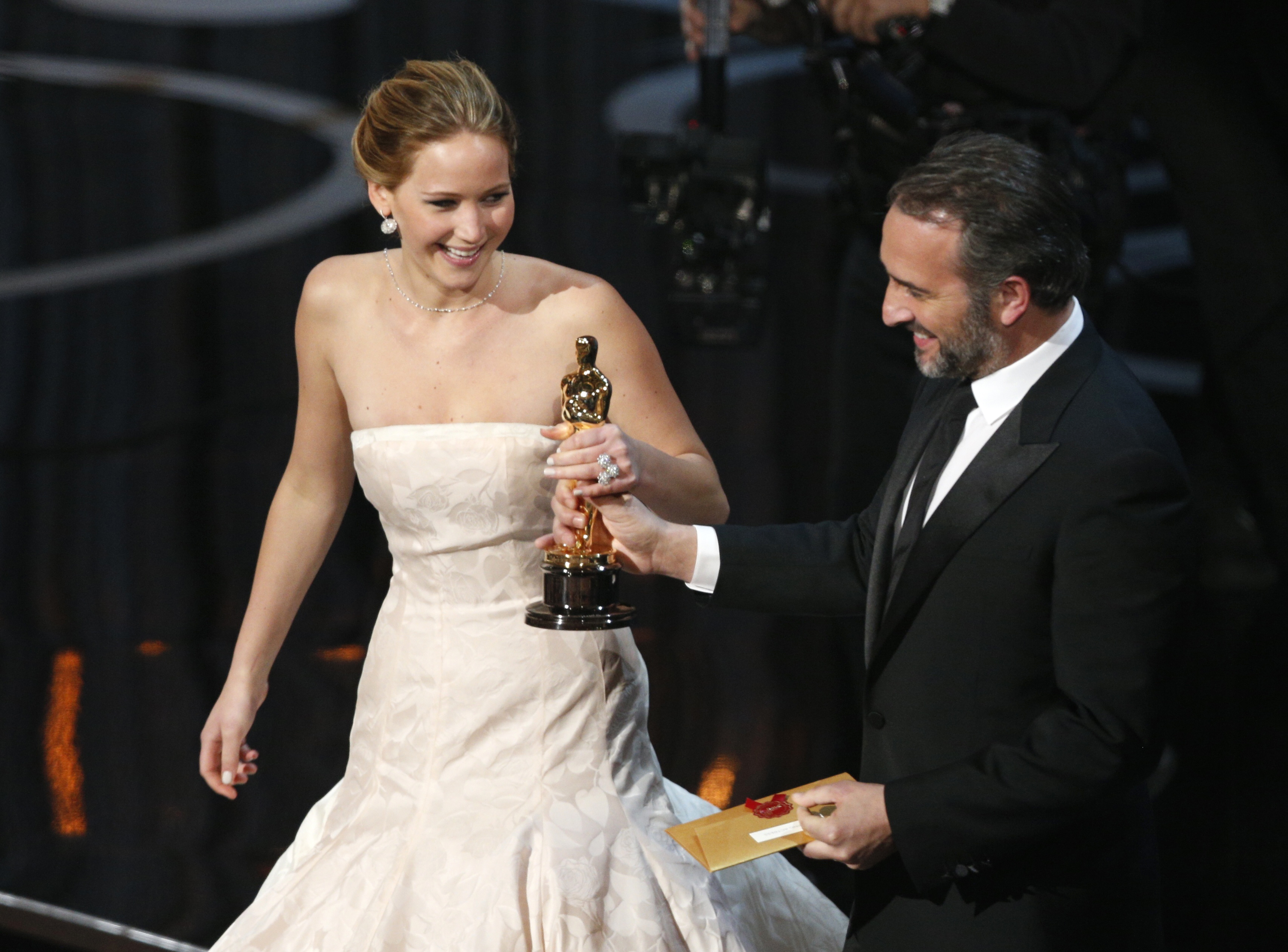 Jennifer Lawrence accepts the award for Best Actress for her role in Silver Linings Playbook from presenter Jean Dujardin at the 85th Academy Awards on Feb. 24, 2013 in Los Angeles.