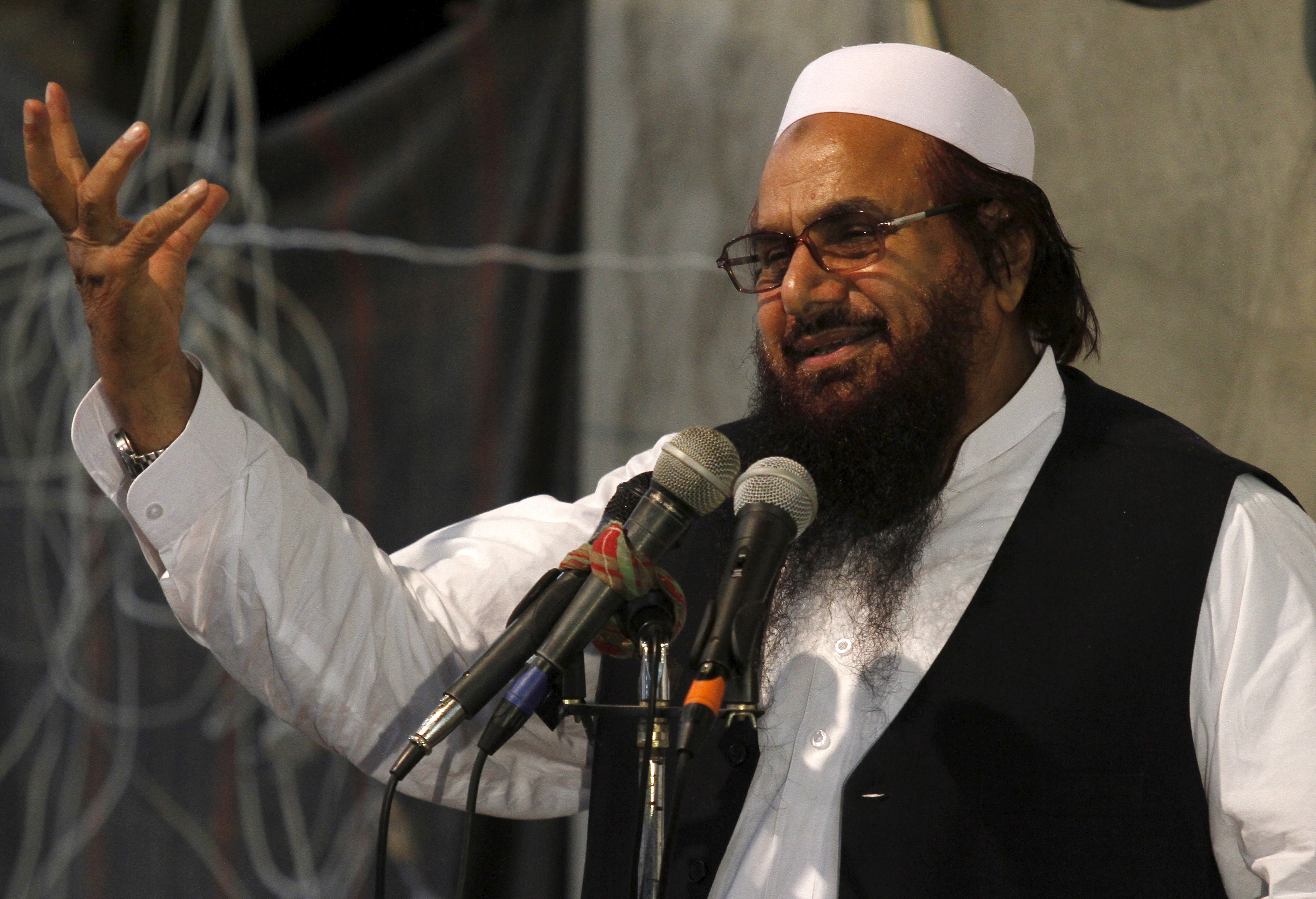 Hafiz Muhammad Saeed, chief of the Jamat-ud-Dawa religious party, addresses the Harmain Sharifain Conference in support of the Saudi Arabian government in Peshawar