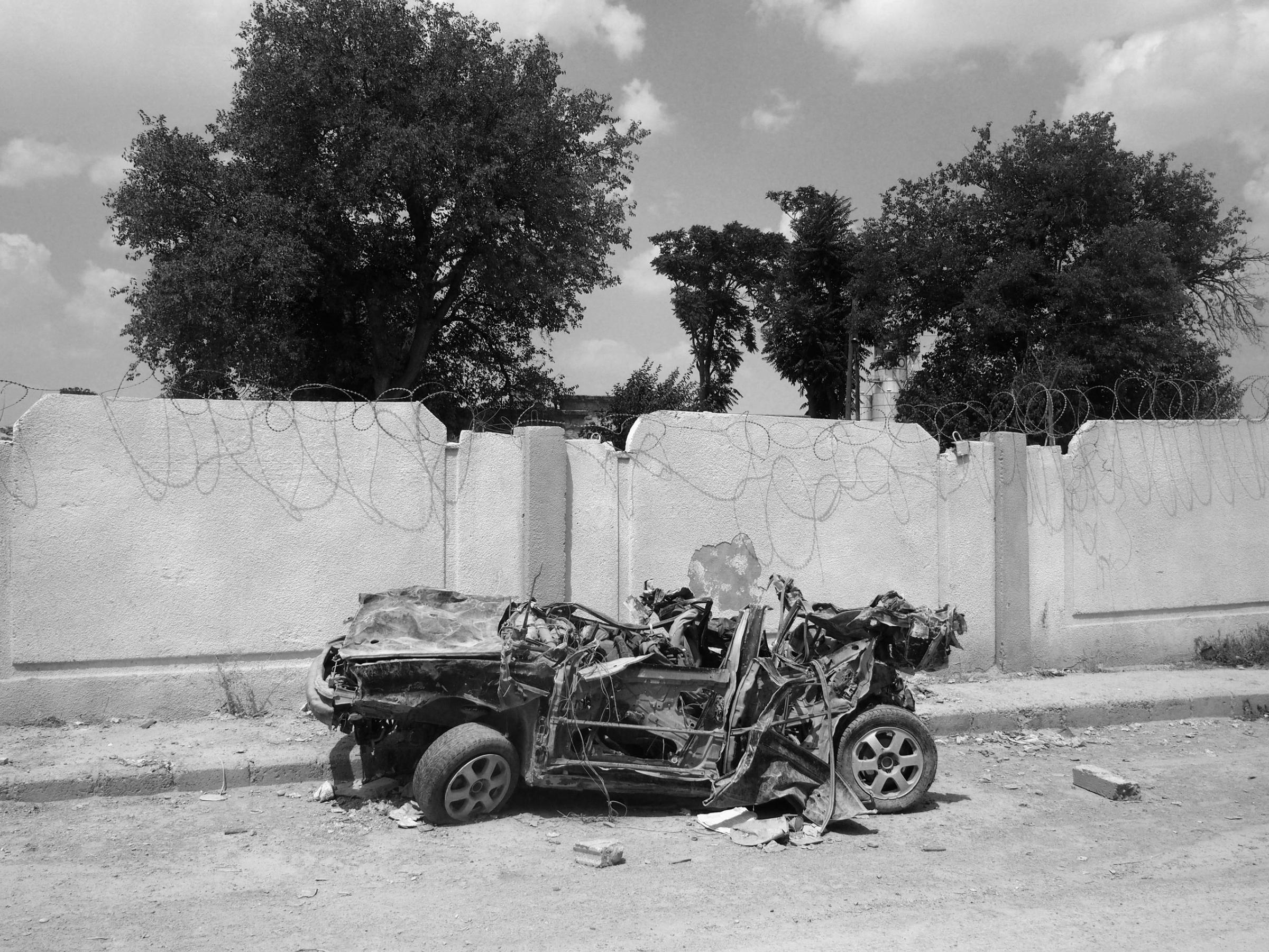 Kobane, Syria. August 8, 2015.A car damaged during the fighting in the Kurdish-held city of Kobane. In January 2015, the YPG backed by coalition airstrikes succeeded in expelling the Islamic State (IS) from the town. Seventy percent of the city was destroyed by airstrikes and fighting. The YPG now controls the town, which has mostly been reduced to rubble.(Photo by Moises Saman/MAGNUM)