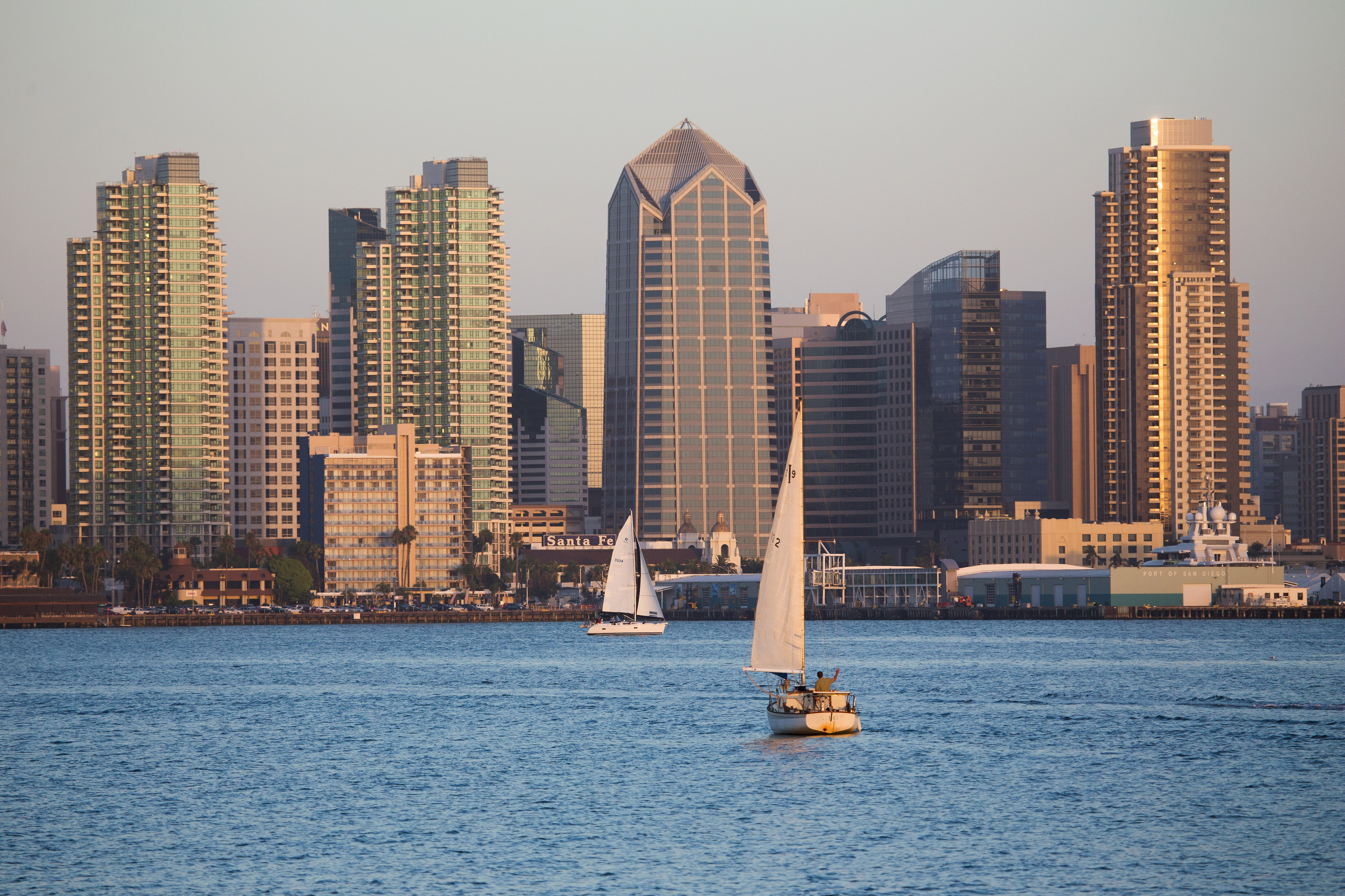 Scenic San Diego skyline, sailboat and waterfront, Pacific Ocean at sunset, California