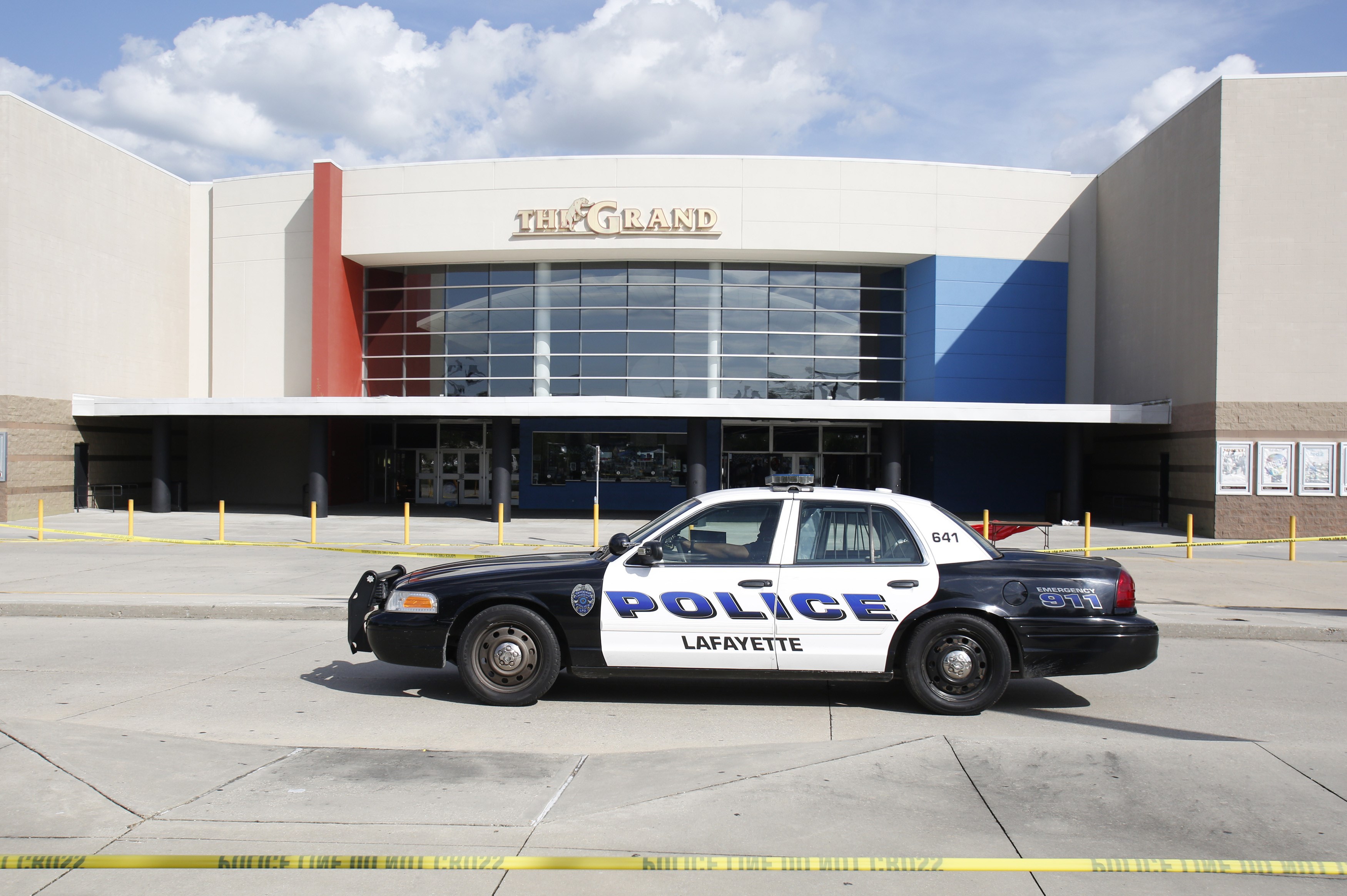 A police car stands outside The Grand Theatre on July 24, 2015 in Lafayette, La., following the previous night's deadly shooting. (Yuri Gripas&mdash;AFP/Getty Images)