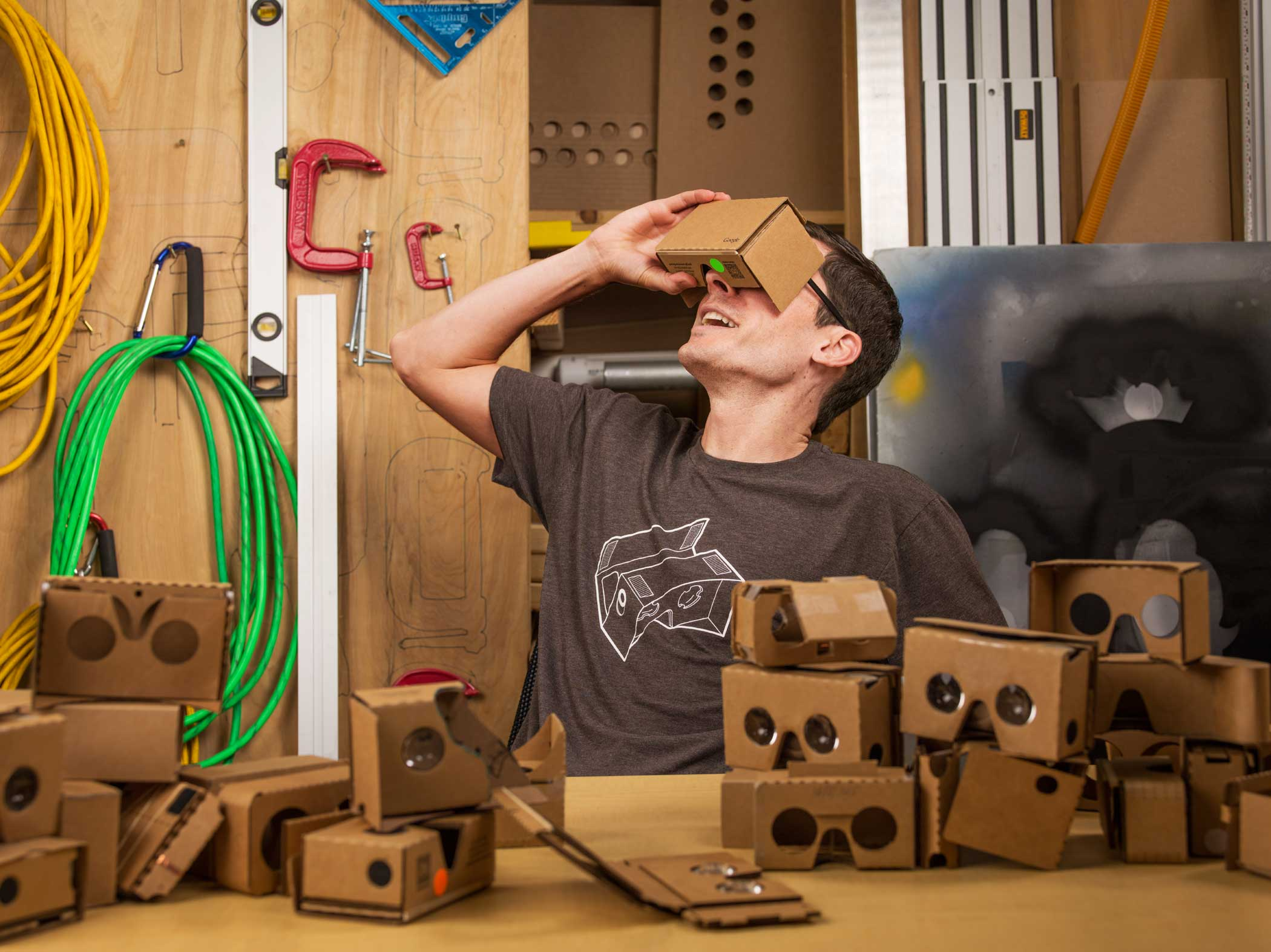 Clay Bavor wears a Google Cardboard headset in the google woodworking shop in googles hq in mountain view, CA on june 24, 2015.