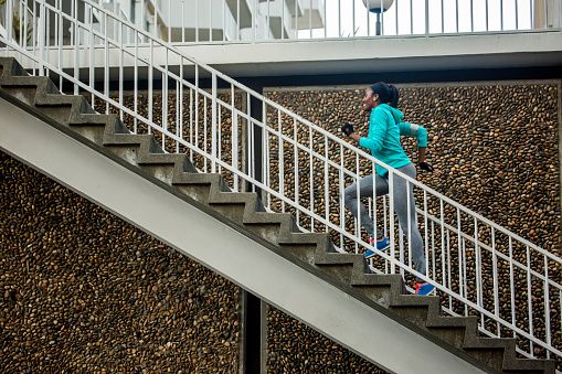 black-woman-running-stairs