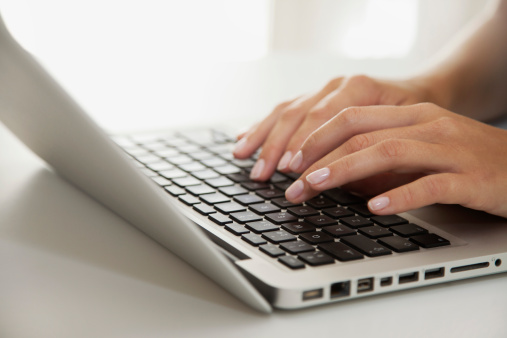 women-hands-typing-laptop