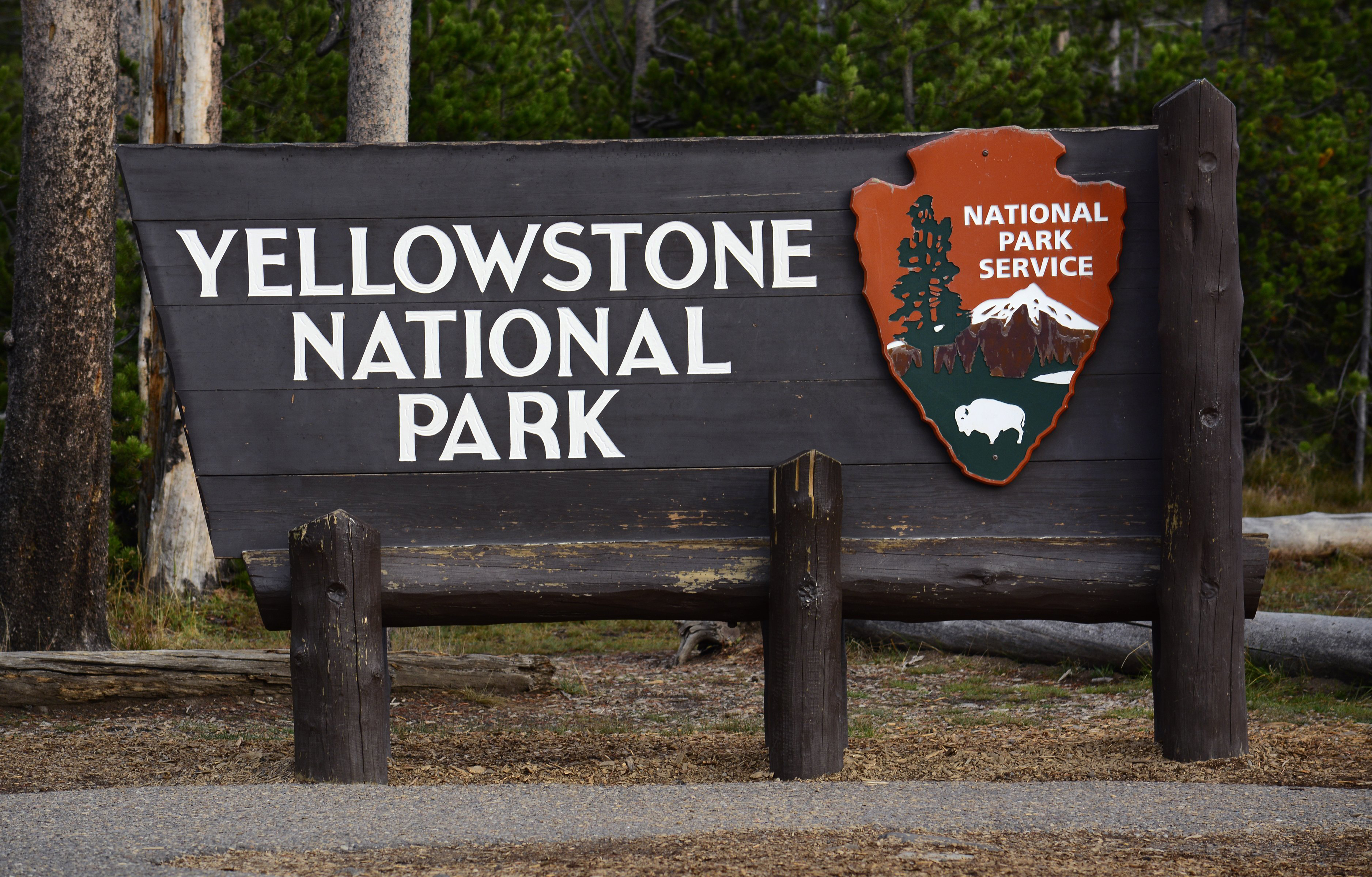 A National Park Service sign welcomes visitors to Yellowstone National Park in Wyoming. (Robert Alexander—Getty Images)