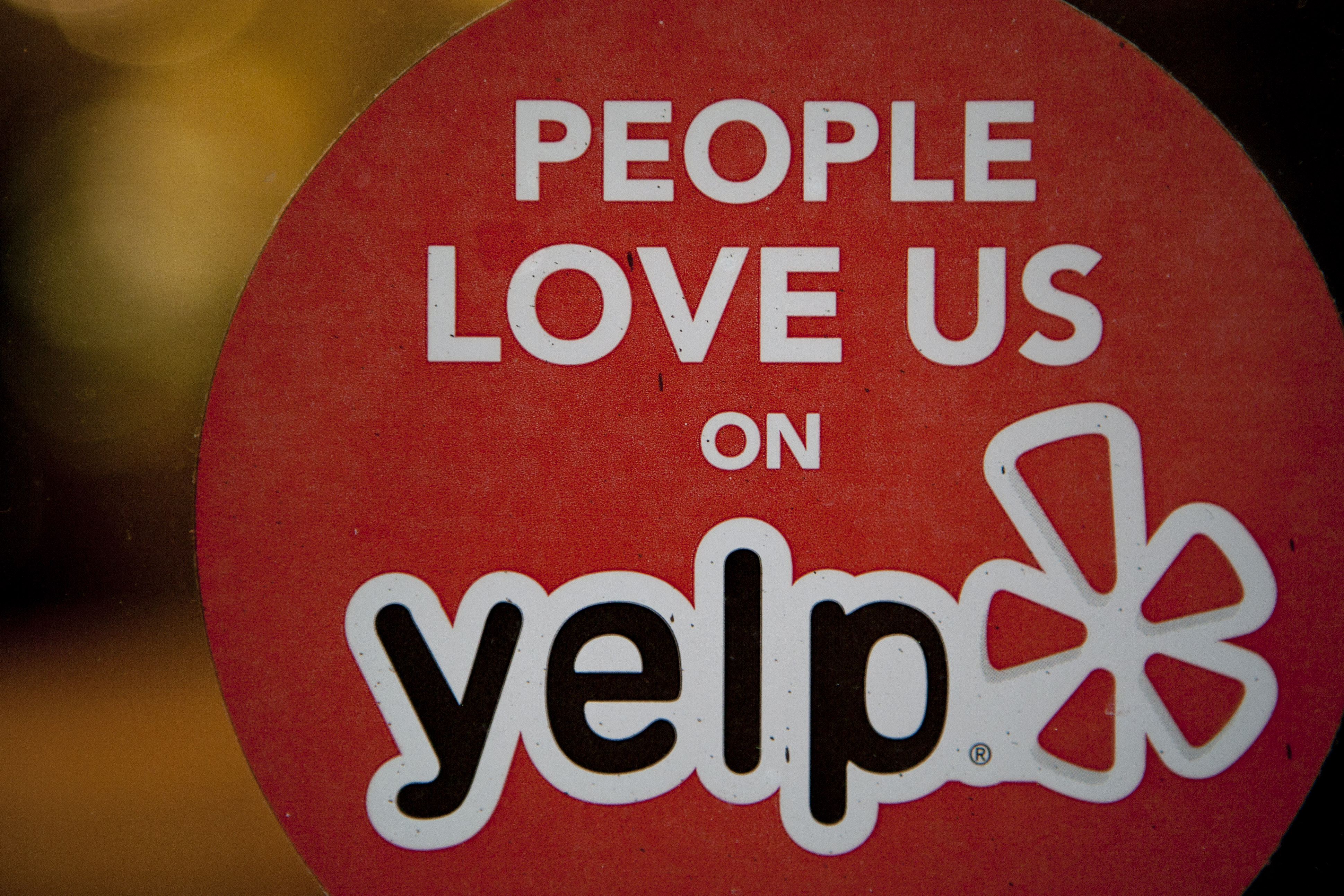 The Yelp logo is displayed in the window of a restaurant in New York on March 1, 2012. (Scott Eells—Bloomberg via Getty Images)