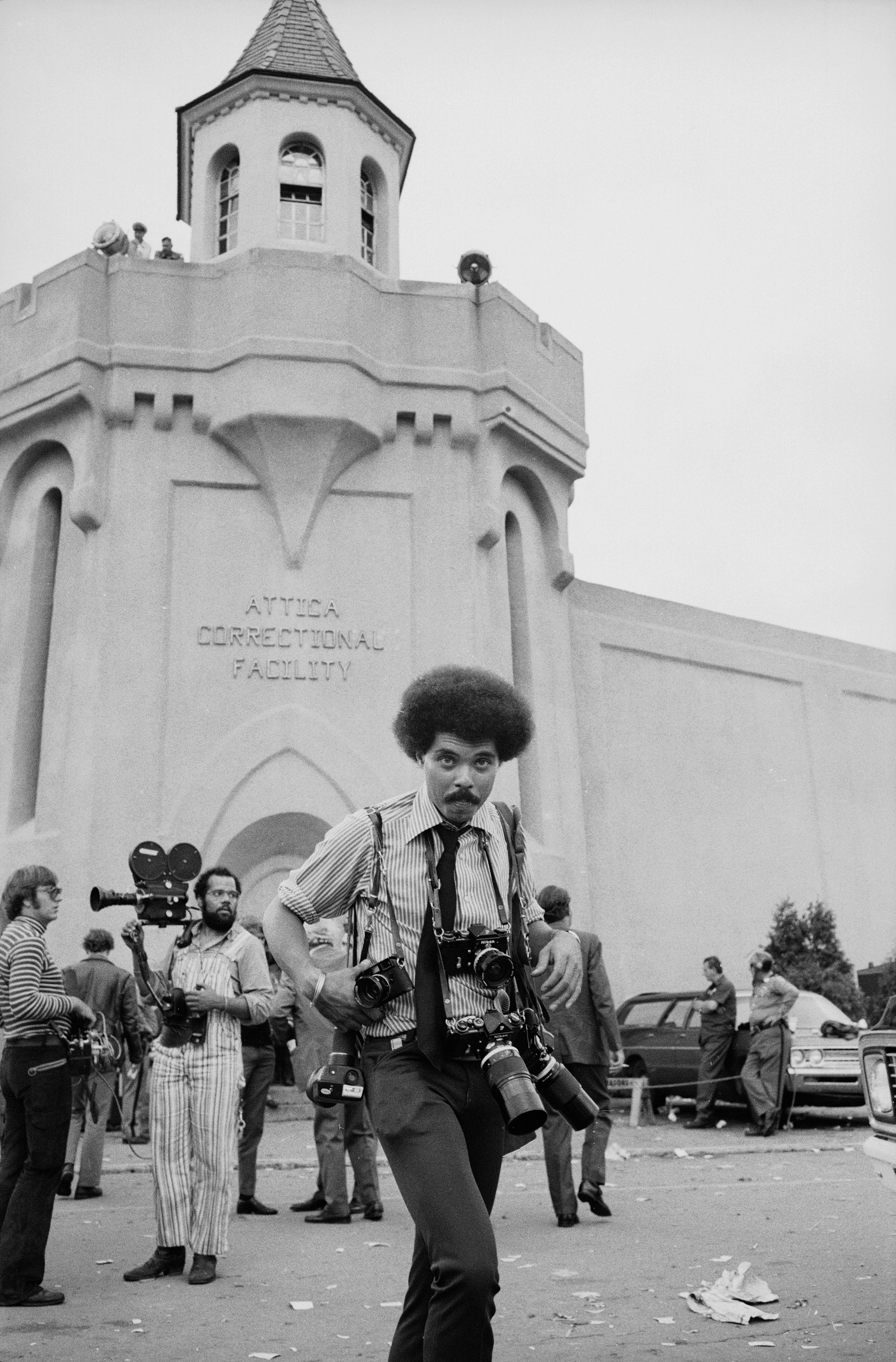 LIFE photographer John Shearer on assignment outside Attica prison during a prisoner riot and uprising.