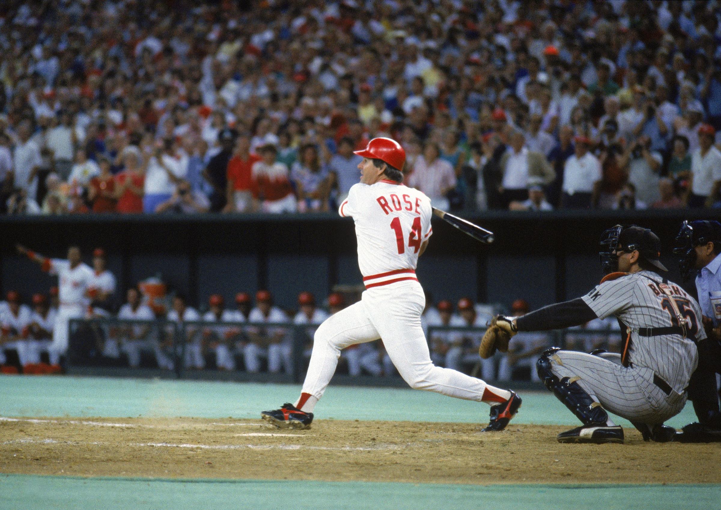 Pete Rose #14 of the Cincinnati Reds follows through with the hit against the San Diego Padres during a game on September 11, 1985 at Riverfront Stadium in Cincinnati, Ohio. Pete Rose scores his 4192 hit off of pitcher Eric Show, breaking Ty Cobb's record.