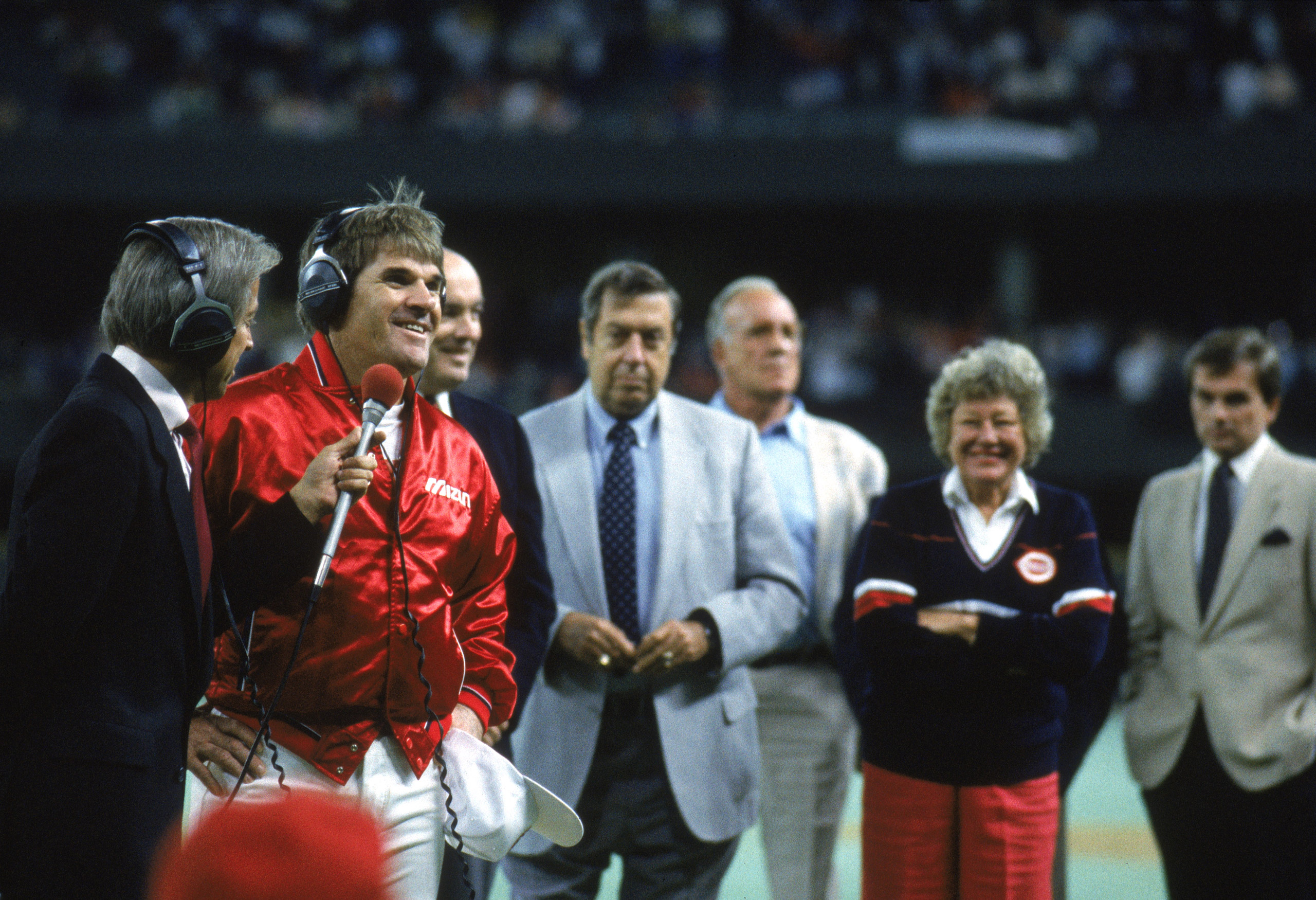 Pete Rose #14 of the Cincinnati Reds stands with an announcer in victory on his 4,192th hit.
