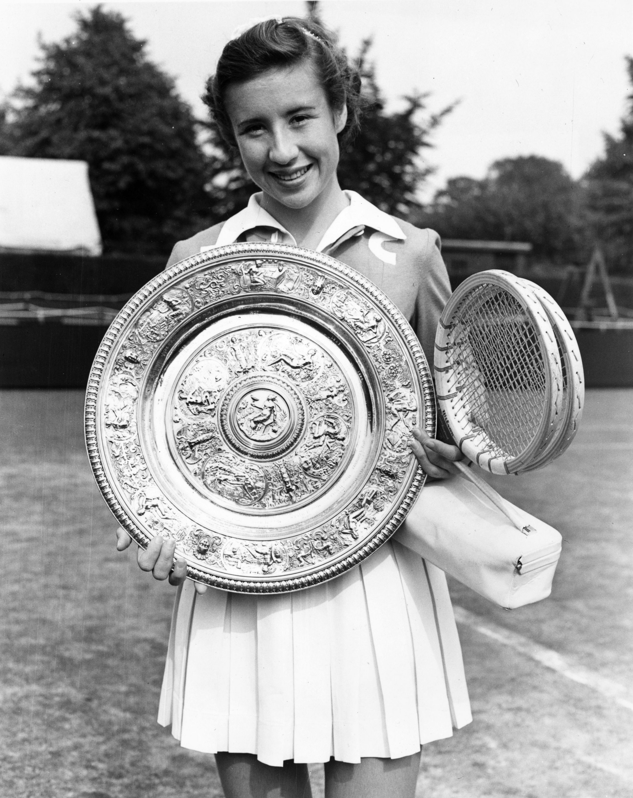 American tennis player Maureen Connolly (Little Mo) with the women's singles trophy after beating Doris Hart in the final at the Wimbledon Lawn Tennis Championships, July 1953.