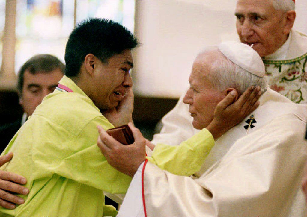 Frank Rocha of Amarillo, Texas, weeps as he is blessed by Pope John Paul II at Denver's Cathedral of the Immaculate Conception on August 14, 1993. Rocha was among 300 delegates from the World Youth Day who attended mass with the Pope.