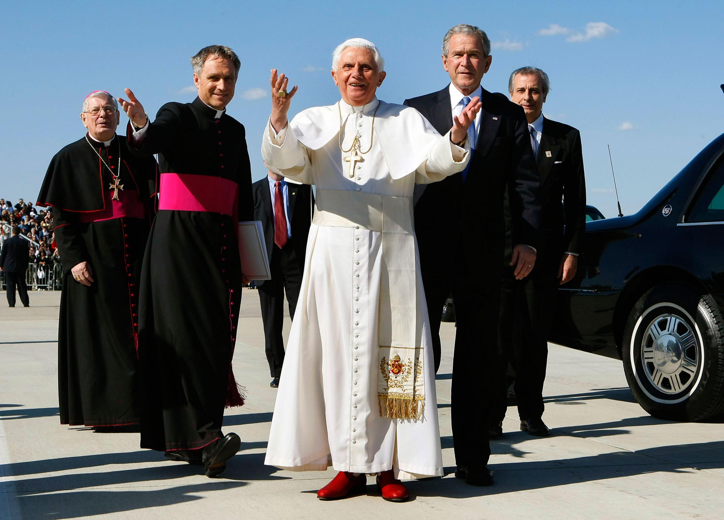 Pope Benedict XVI reacts to the cheering crowd as he stands with U.S. President George W. Bush upon his arrival at Andrews Air Force Base, April 15, 2008 in Camp Springs, Maryland.