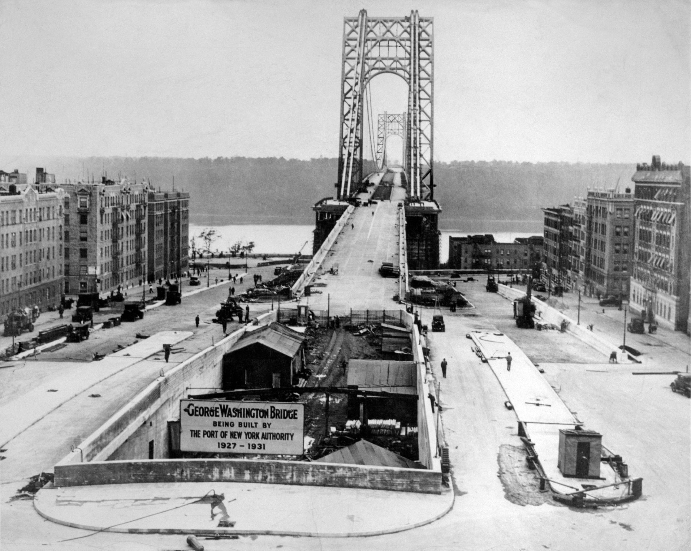 10/19/1931-New York- THE ROAD'S CLEAR...That will be the signal when the new Washington Memorial Bridge over the Hudson River is opened with appropriate ceremony. In the meantime, here's a new and unusual view of the structure from the New York end, showing the underground approach as well as the one on the surface and the exit. That's New Jersey over in the distance.