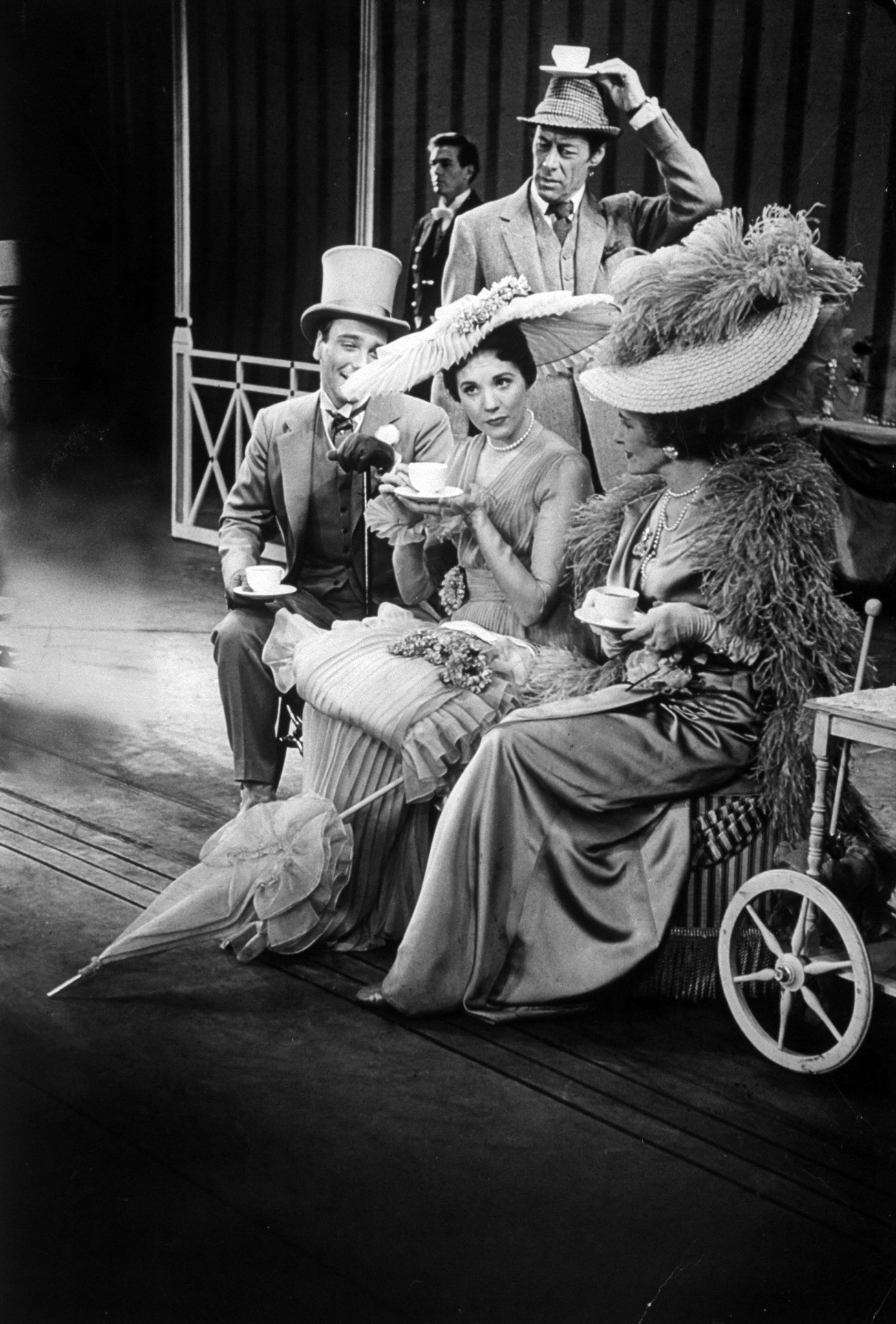 Scenes from the play, My Fair Lady with Rex Harrison, and Julie Andrews.