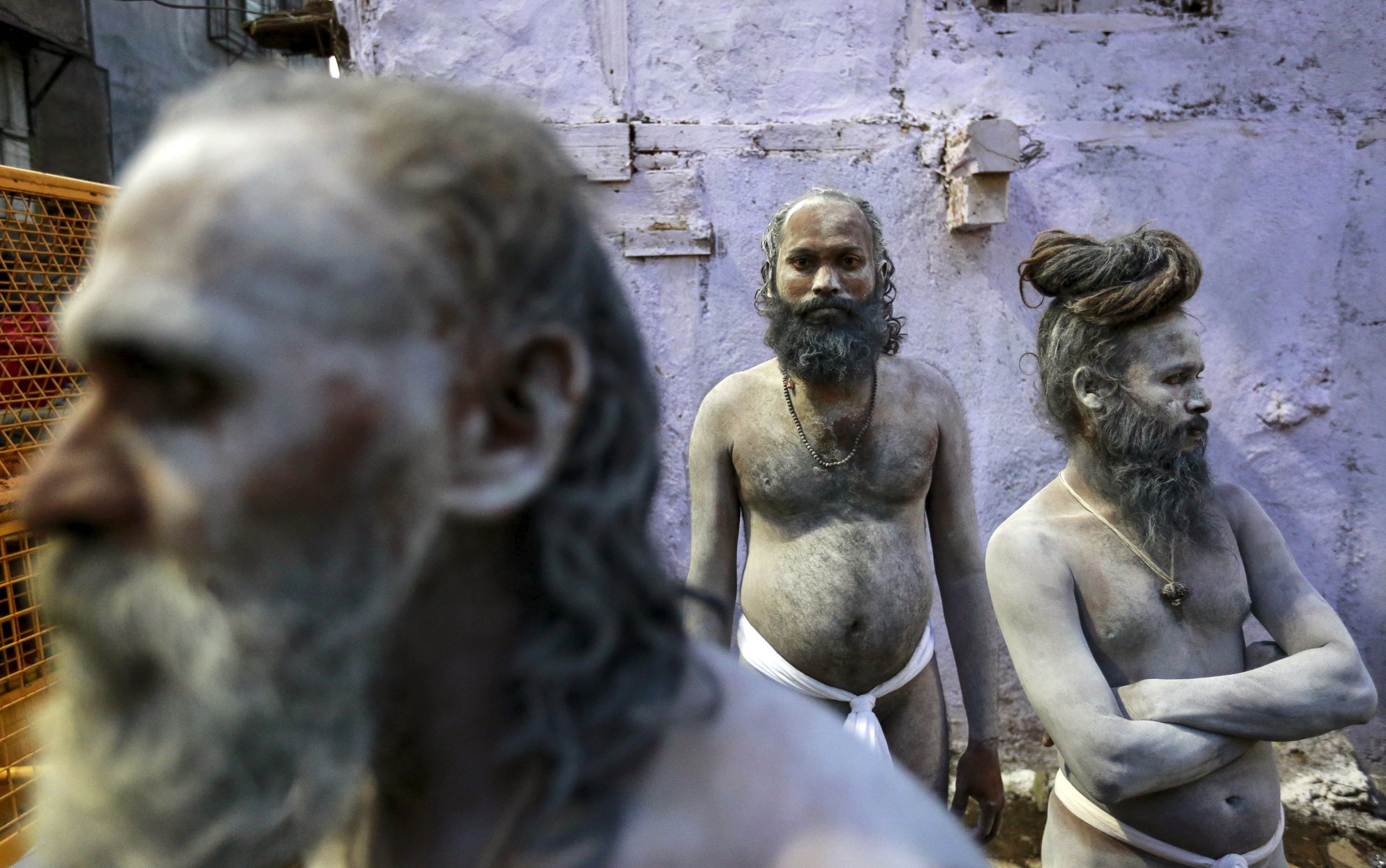 Naga Sadhus, or Hindu holy men, wait during a procession before taking a dip in a holy pond during the second "Shahi Snan" (grand bath) at "Kumbh Mela", or Pitcher Festival, in Trimbakeshwar