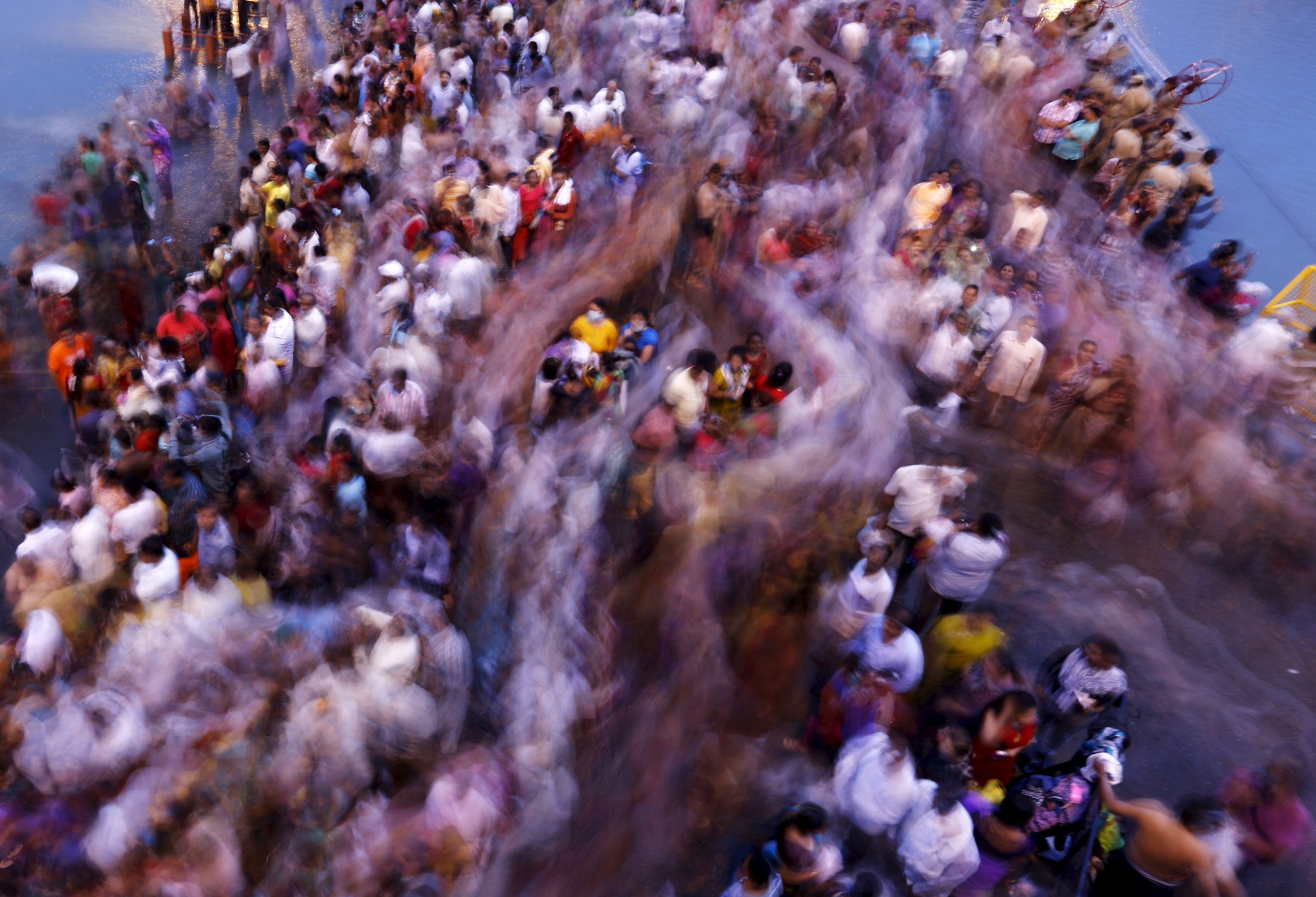 Devotees attend the second  Shahi Snan  (grand bath) on the banks of the Godavari river at the Kumbh Mela or Pitcher Festival in Nashik, India, on Sept.13, 2015.