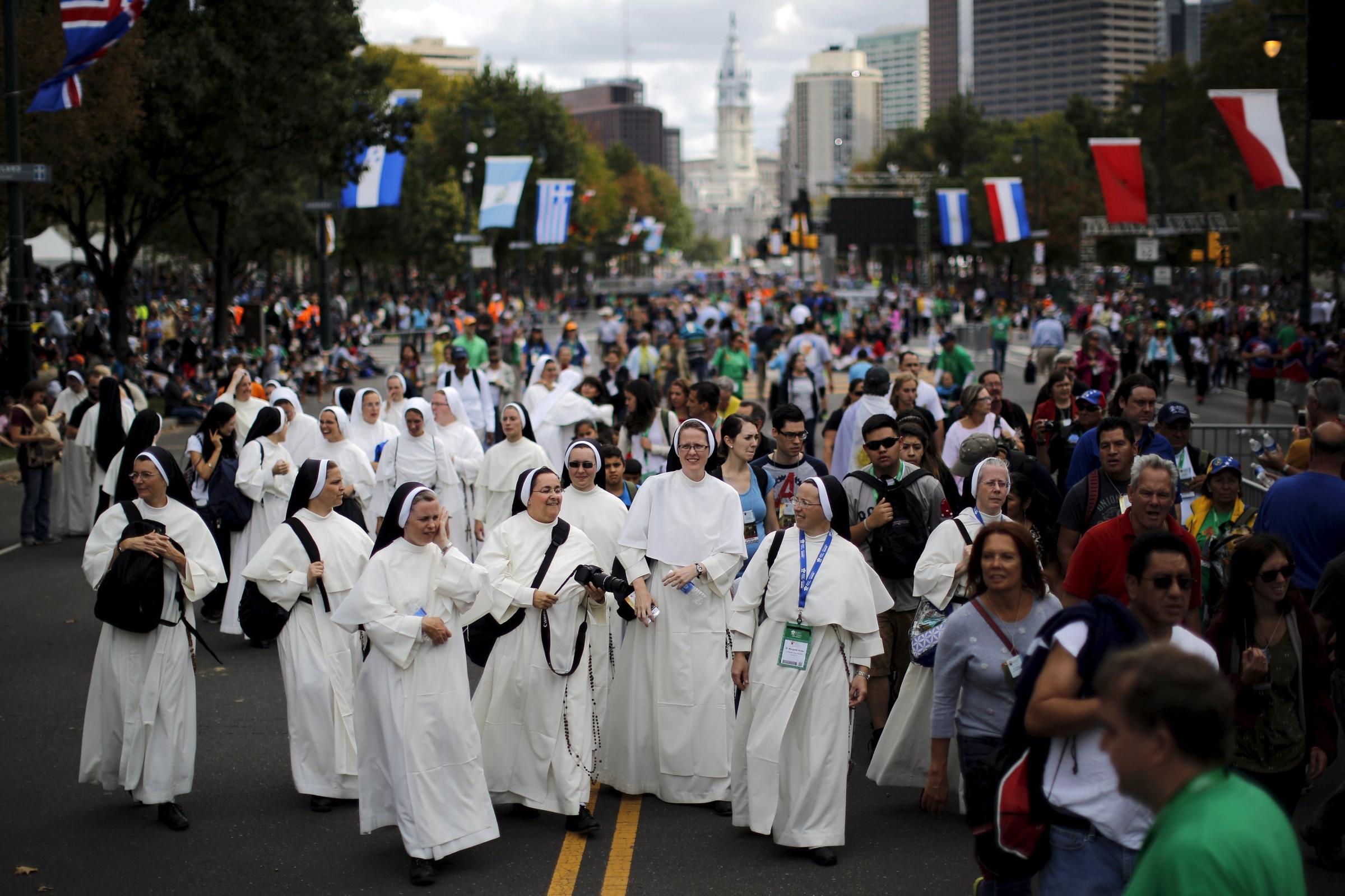Nuns wait for Pope Francis' arrival at the Festival of Families rally along Benjamin Franklin Parkway in Philadelphia, Pennsylvania