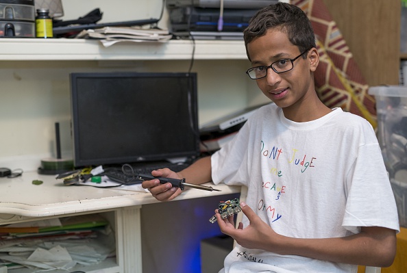 Ahmed Mohamed, a Texas Muslim teen who was arrested after taking his homemade clock to school, explains his clock at his house in Irving, Texas, on Sept. 17, 2015 (Anadolu Agency—Getty Images)