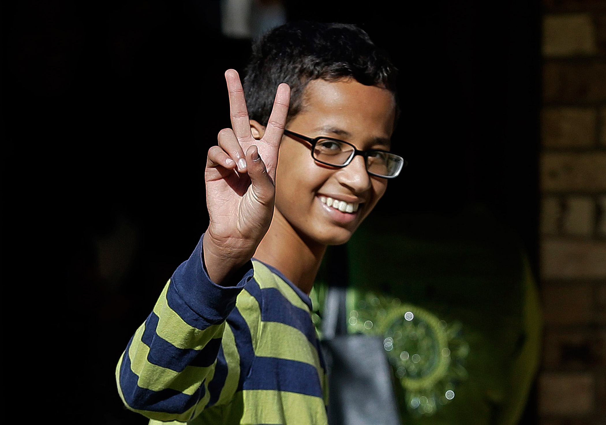 Ahmed Mohamed, 14, gestures as he arrives to his family's home on Sept. 17, 2015 in Irving, Texas. (LM Otero—AP)