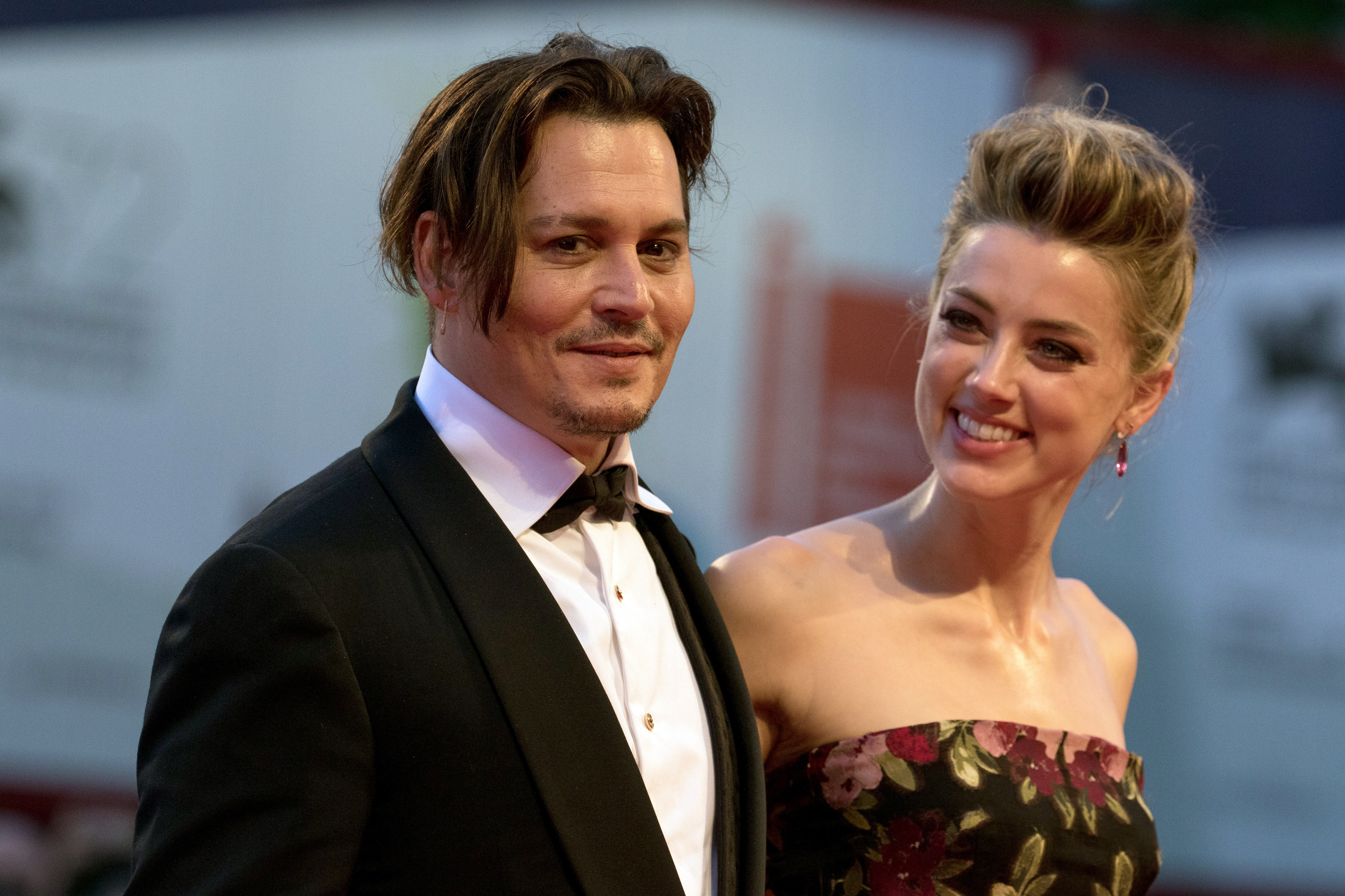 Actors Johnny Depp and Amber Heard attend the premiere of <i>The Danish Girl</i> during the 72nd Venice Film Festival at Palazzo del Cinema in Venice on Sept. 5, 2015 (Hubert Boesl—AP)
