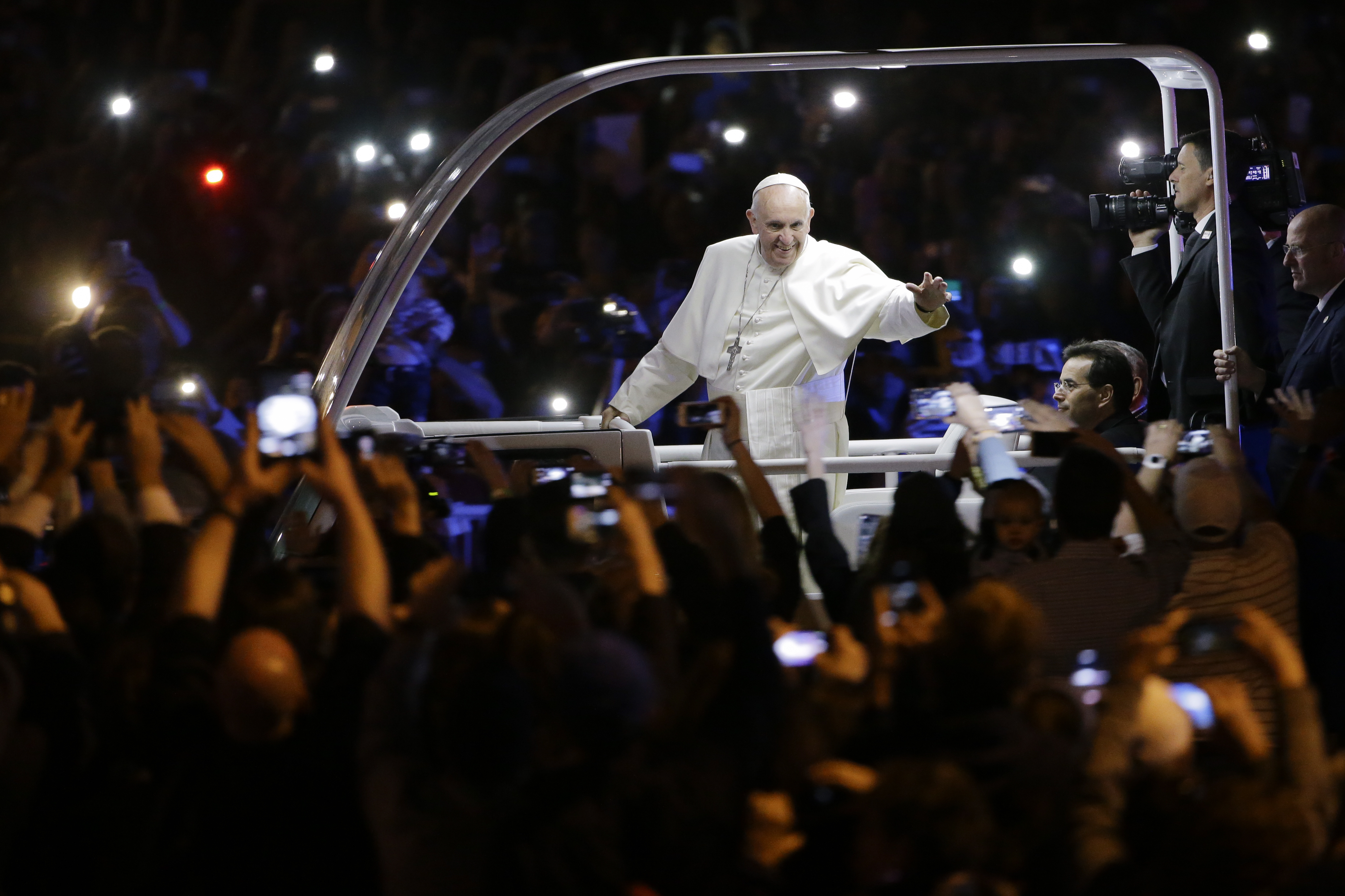 Pope Francis waves to the crowd during a parade in Philadelphia, on Sept. 26, 2015.