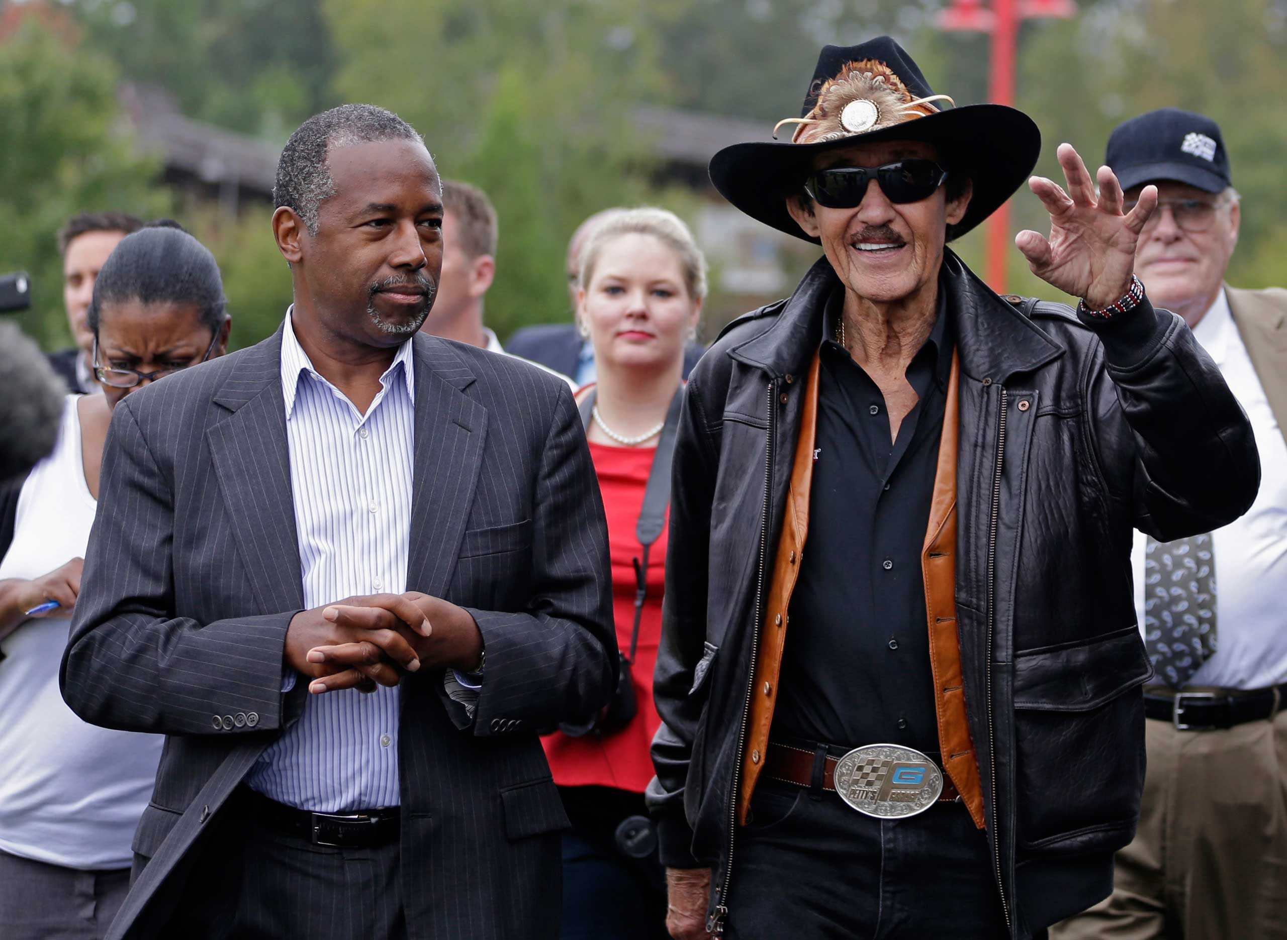 Republican presidential candidate, retired neurosurgeon Ben Carson listens to NASCAR legend Richard Petty during a tour of the Victory Junction Gang Camp in Randleman, N.C., Sept. 28, 2015. (Chuck Burton—AP)