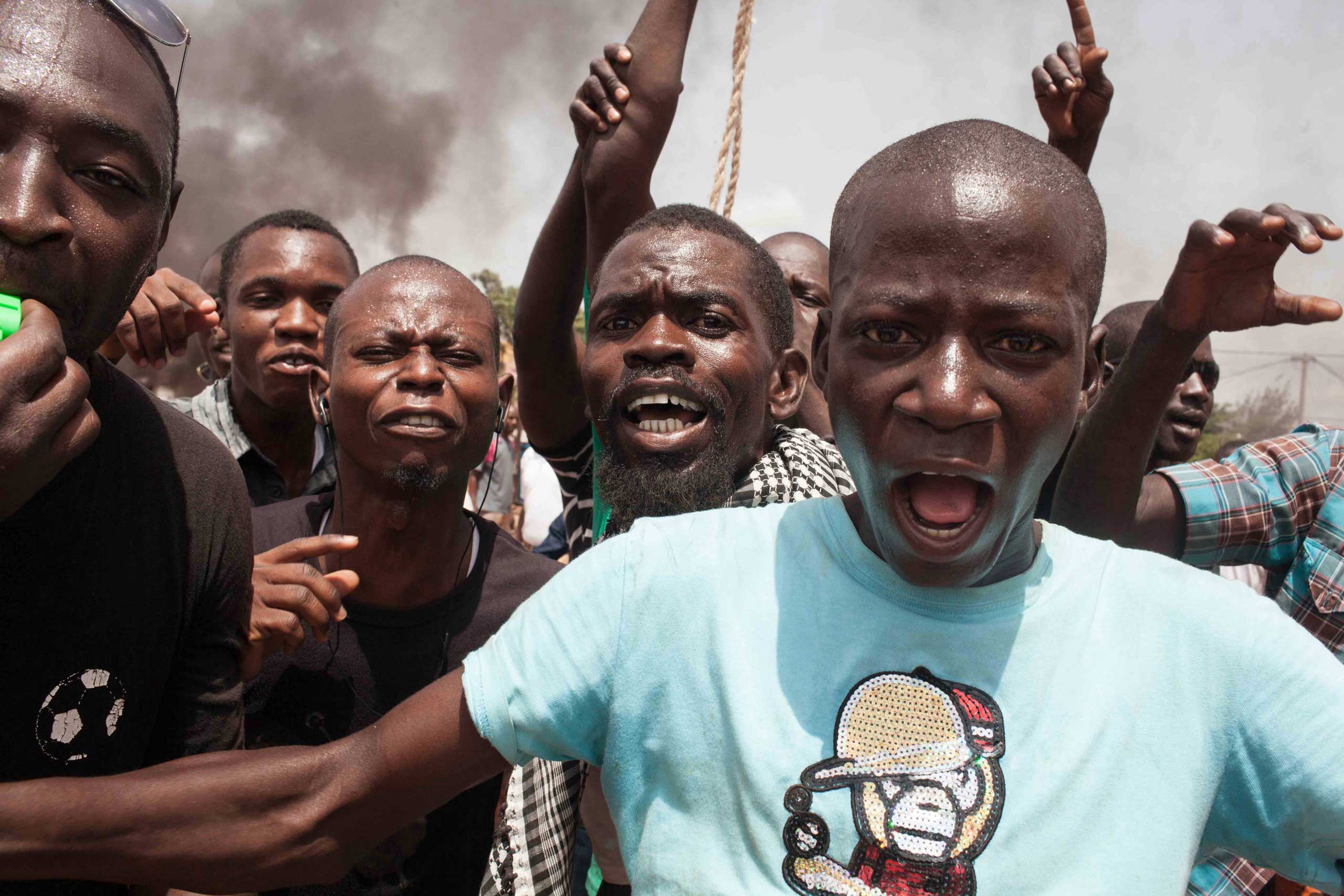 Burkina Faso protestors shout out as they take to the streets in the city of Ouagadougou, Burkina Faso, on Sept. 17, 2015. (Theo Renaut—AP)