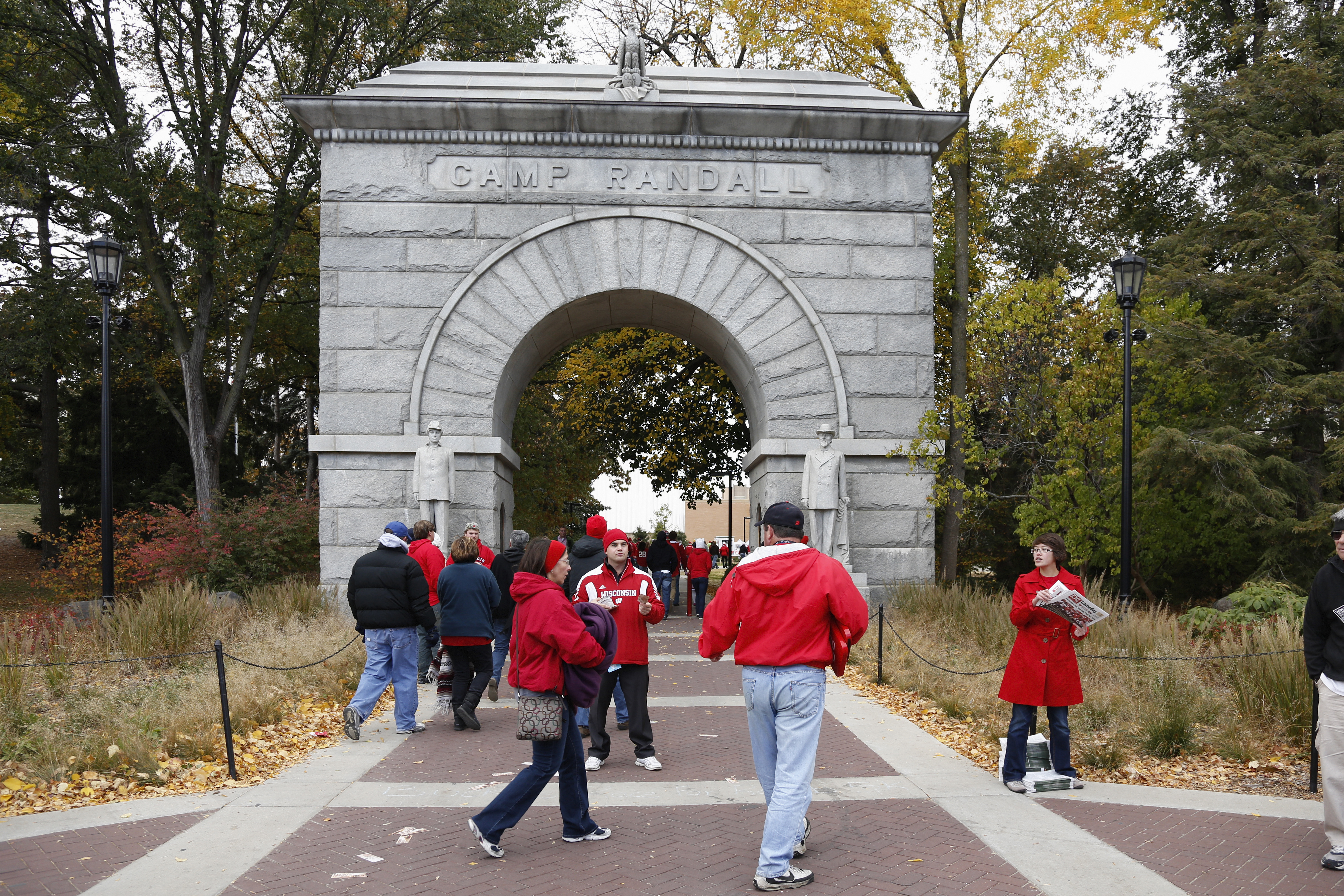 Wisconsin Badgers fans make their way through the Camp Randall Memorial Arch on their way to the game against the Illinois Fighting Illini at Camp Randall Stadium in Madison, Wis. on Oct. 6, 2012.