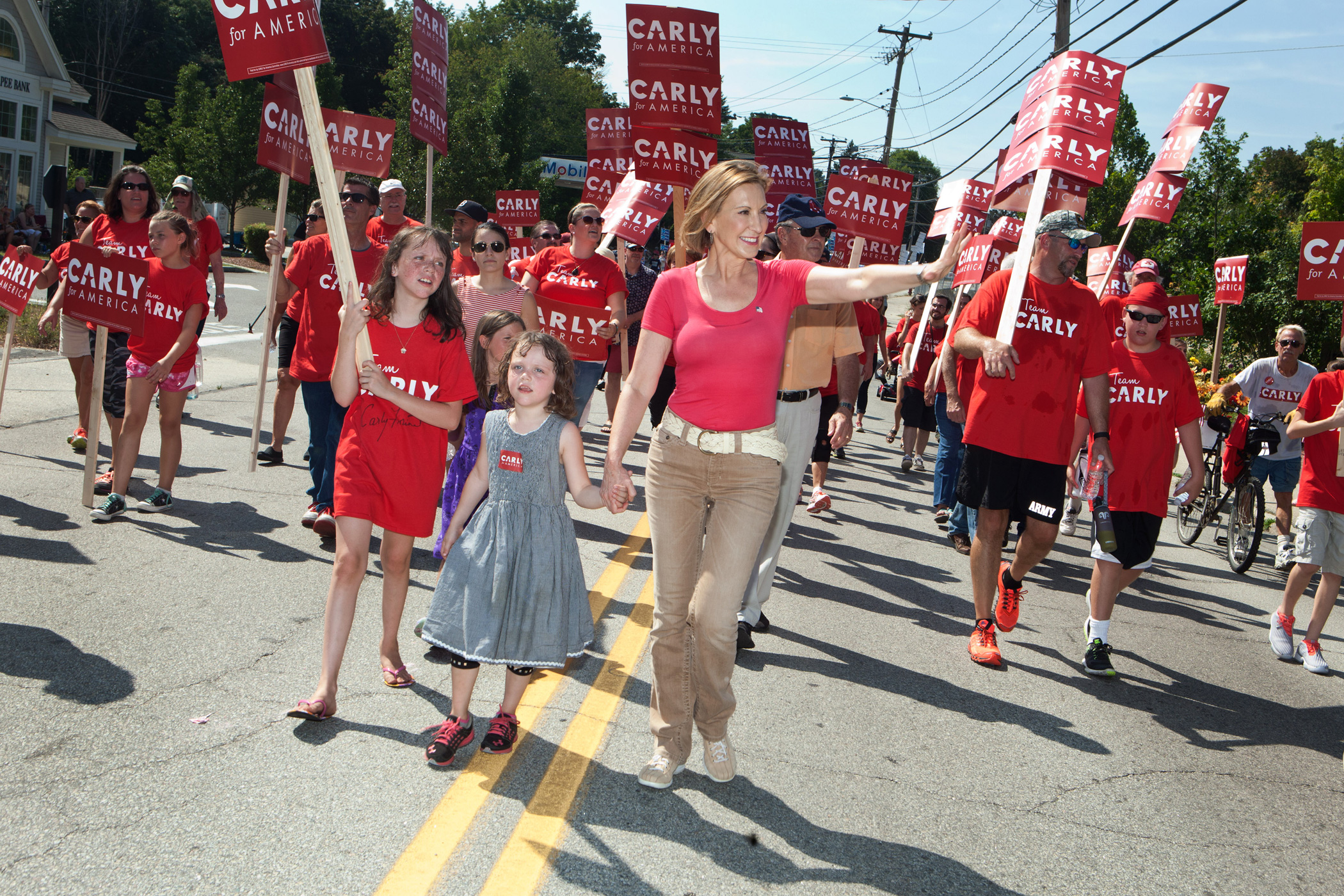 Carly Fiorina marches with her family in the Labor Day parade on Sept. 7, 2015 in Milford, N.H.