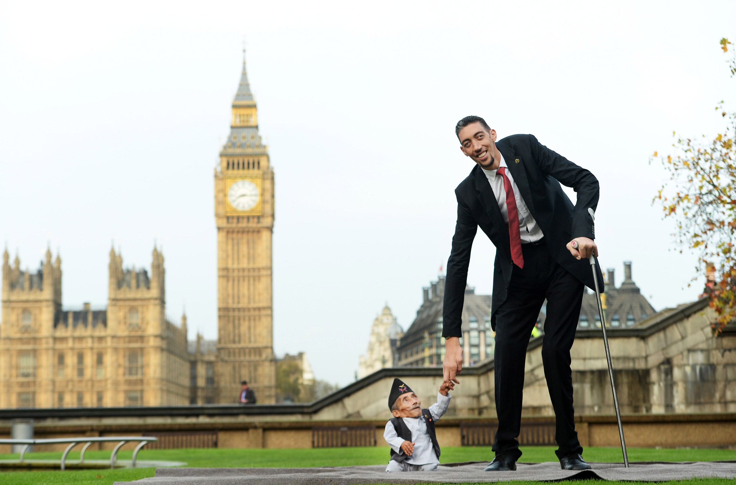 Chandra Bahadur Dangi, formerly the world's shortest man, posing with the world's tallest man, Sultan Kosen from Turkey, during a photocall for the Guinness World Records in London on Nov. 13, 2014. (Facundo Arrizabalaga—EPA/Corbis)
