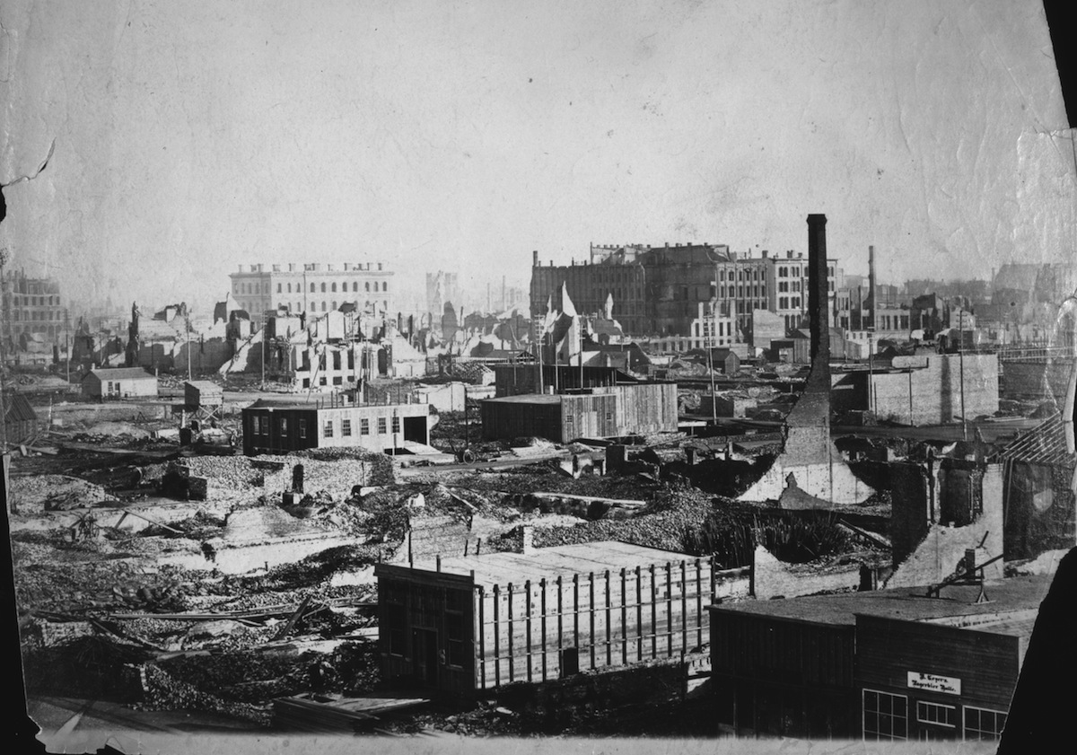 New buildings are already under construction just a few weeks after the catastrophic fire in Chicago, 1871. The view is from the corner of Randolph and Market streets. (Chicago History Museum / Getty Images)