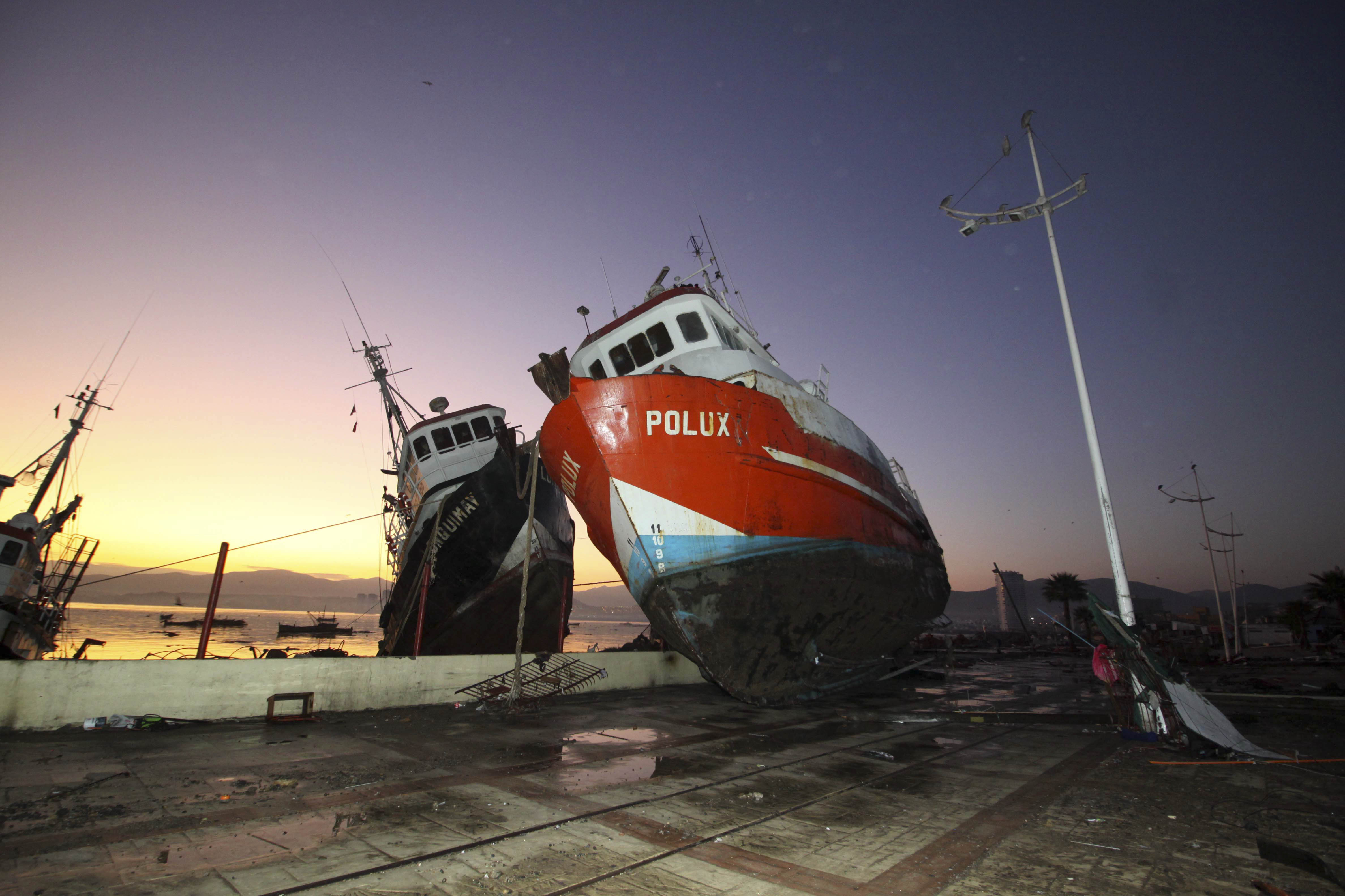 A boat stands on a dock after it was lifted by an earthquake-triggered tsunami in Coquimbo, Chile, Thursday, Sept. 17, 2015. Several coastal towns were flooded from small tsunami waves set off by late Wednesday's magnitude-8.3 earthquake, which shook the Earth so strongly that rumbles were felt across South America. (Hernan Contreras&mdash;AP)