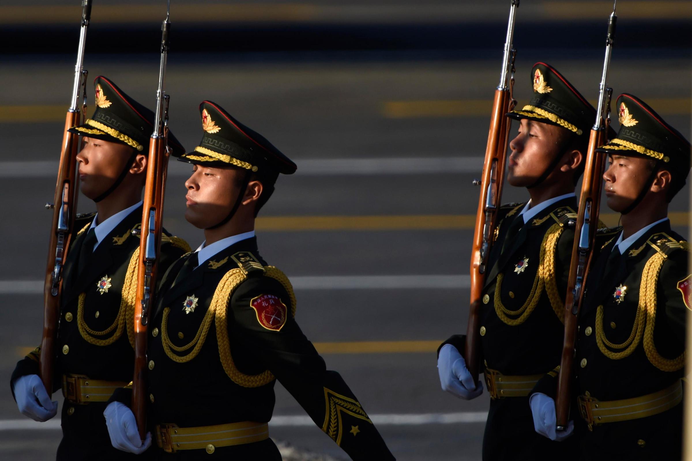 BEIJING, CHINA - SEPTEMBER 03: (CHINA OUT) Guards of honor walk past Tiananmen Gate during the 9.3 military parade on September 3, 2015 in Beijing, China. China is marking the 70th anniversary of the end of World War II and its role in defeating Japan with a new national holiday and a military parade in Beijing. (Photo by ChinaFotoPress/ChinaFotoPress via Getty Images)