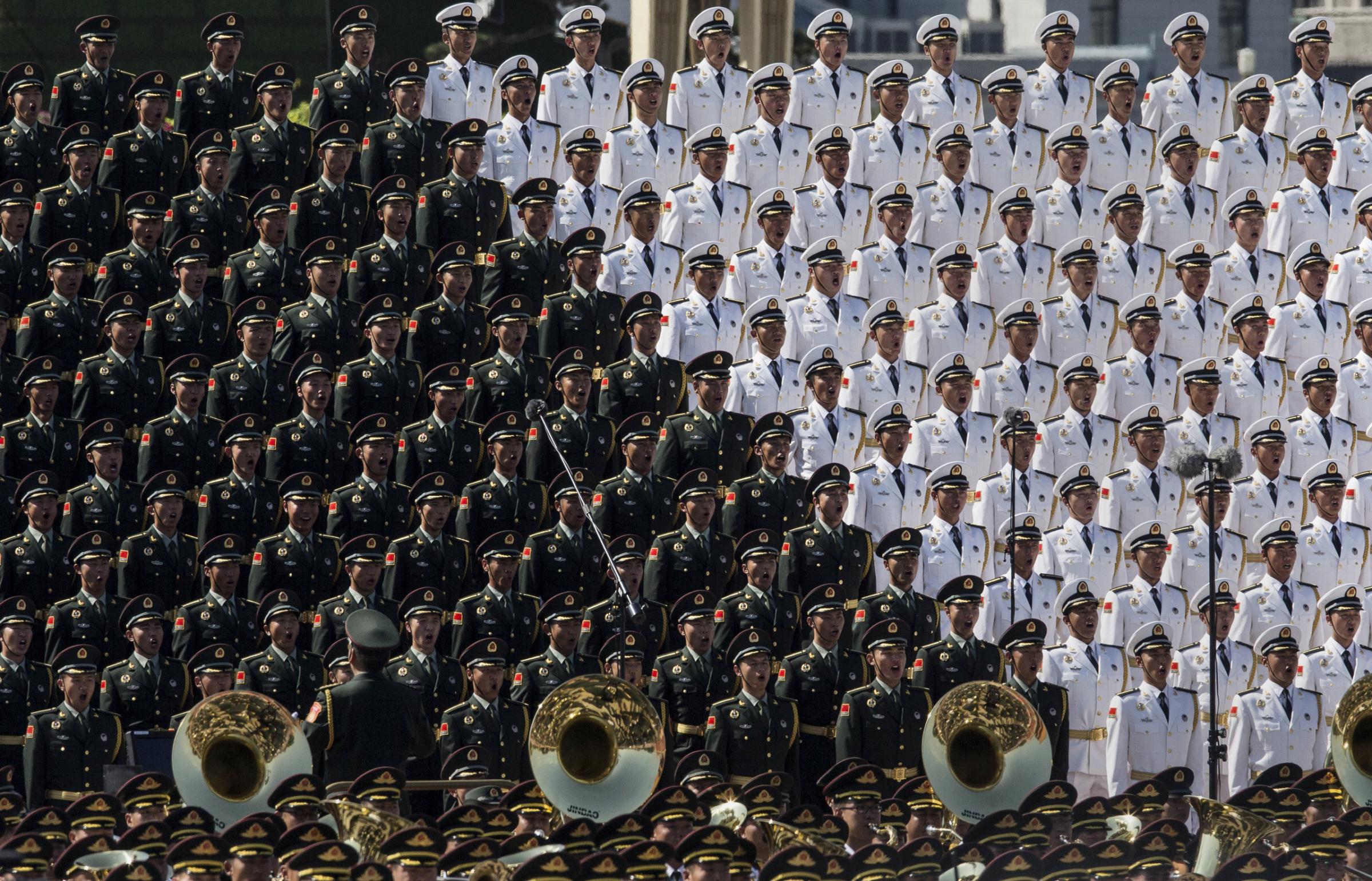 BEIJING, CHINA - SEPTEMBER 03: Members of a Chinese military choir sing near Tiananmen Square and the Forbidden City during a military parade on September 3, 2015 in Beijing, China. China is marking the 70th anniversary of the end of World War II and its role in defeating Japan with a new national holiday and a military parade in Beijing. (Photo by Kevin Frayer/Getty Images)
