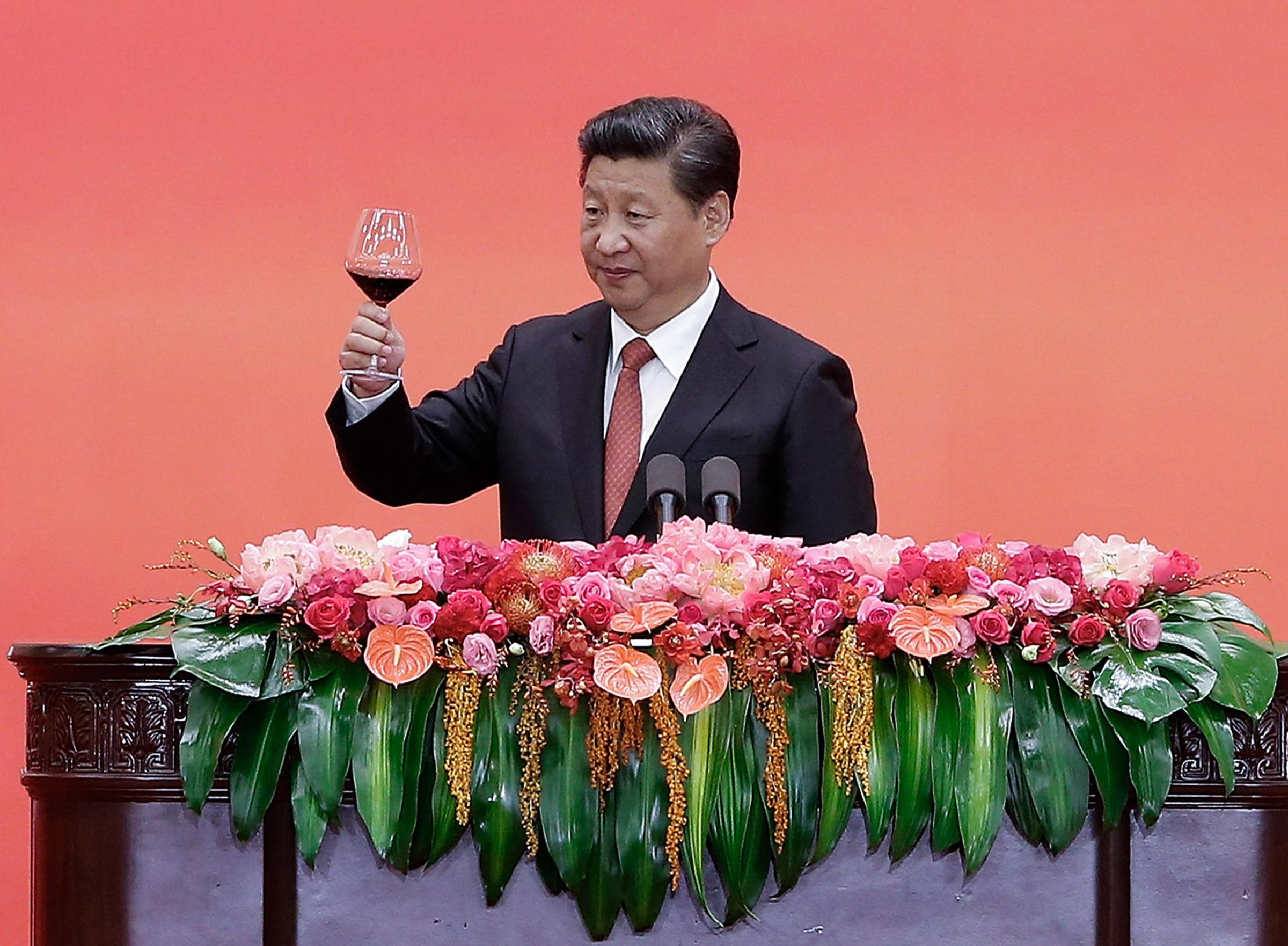 Chinese President Xi Jinping offers a toast after delivering a speech during a reception to mark the 70th anniversary of Japan's surrender during World War II in Beijing, Thursday, Sept. 3, 2015. (Lintao Zhang/Pool Photo via AP)
