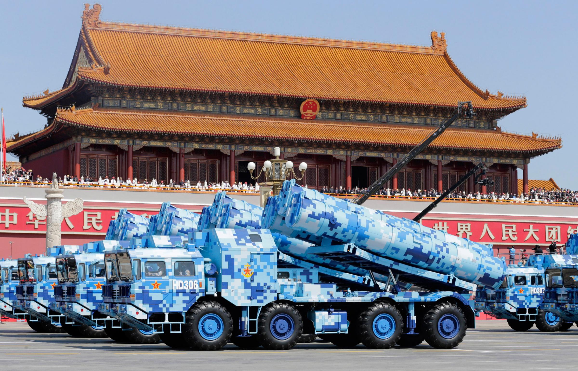 BEIJING, CHINA - SEPTEMBER 03: Military vehicles carrying shore-to-ship missiles drive past the Tiananmen Gate during a military parade to mark the 70th anniversary of the end of World War Two on September 3, 2015 in Beijing, China. China is marking the 70th anniversary of the end of World War II and its role in defeating Japan with a new national holiday and a military parade in Beijing. (Photo by Jason Lee - Pool/Getty Images)