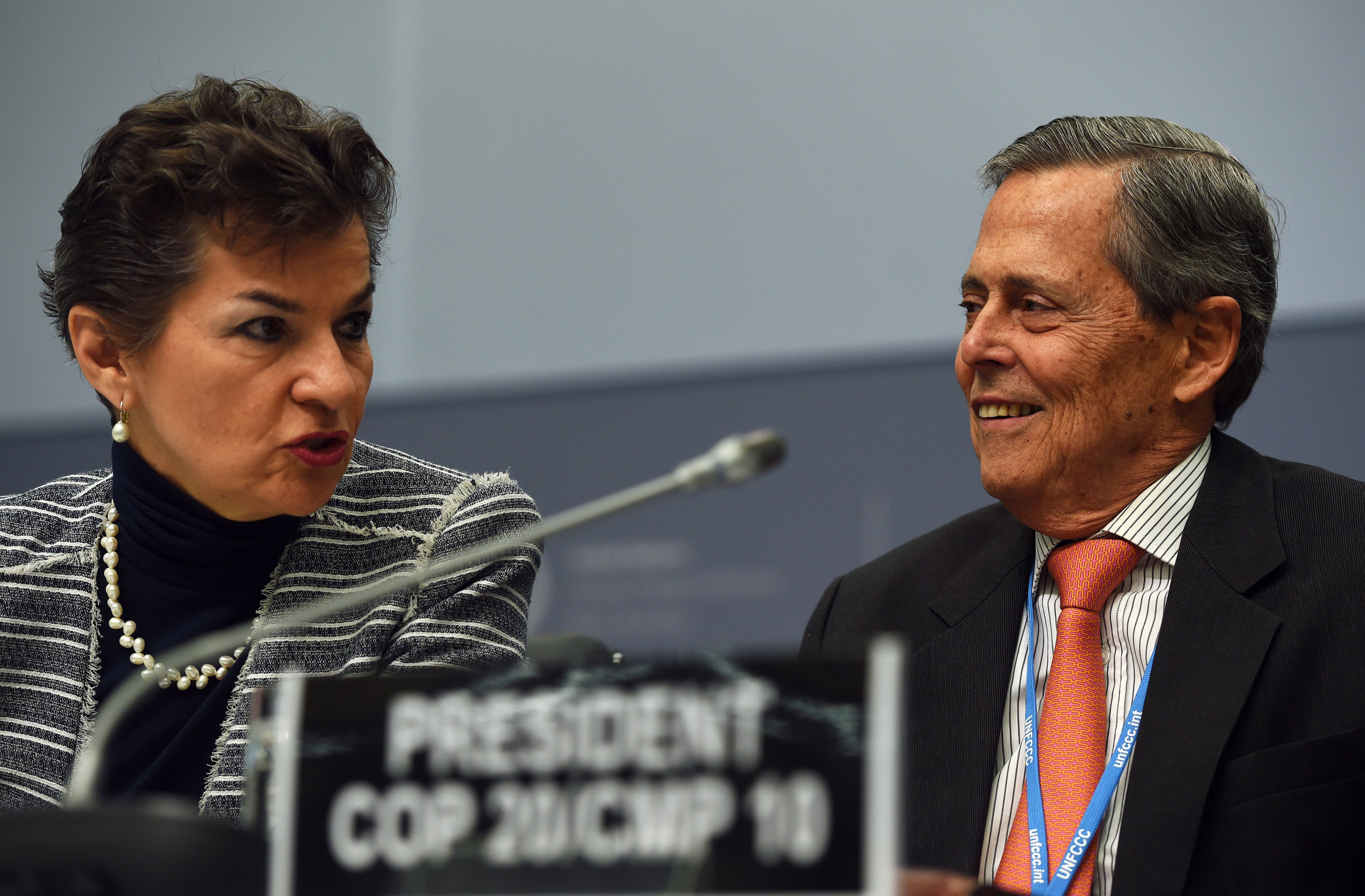 Special Representative of Peru for Climate Change, Jorge Voto Bernales (right), and Executive Secretary of the United Nations Framework Convention on Climate Change (UNFCCC), Christiana Figueres, during the UNFCCC opening ceremony in Bonn, Germany, on June 1, 2015. (Patrik Stollarz—AFP/Getty Images)
