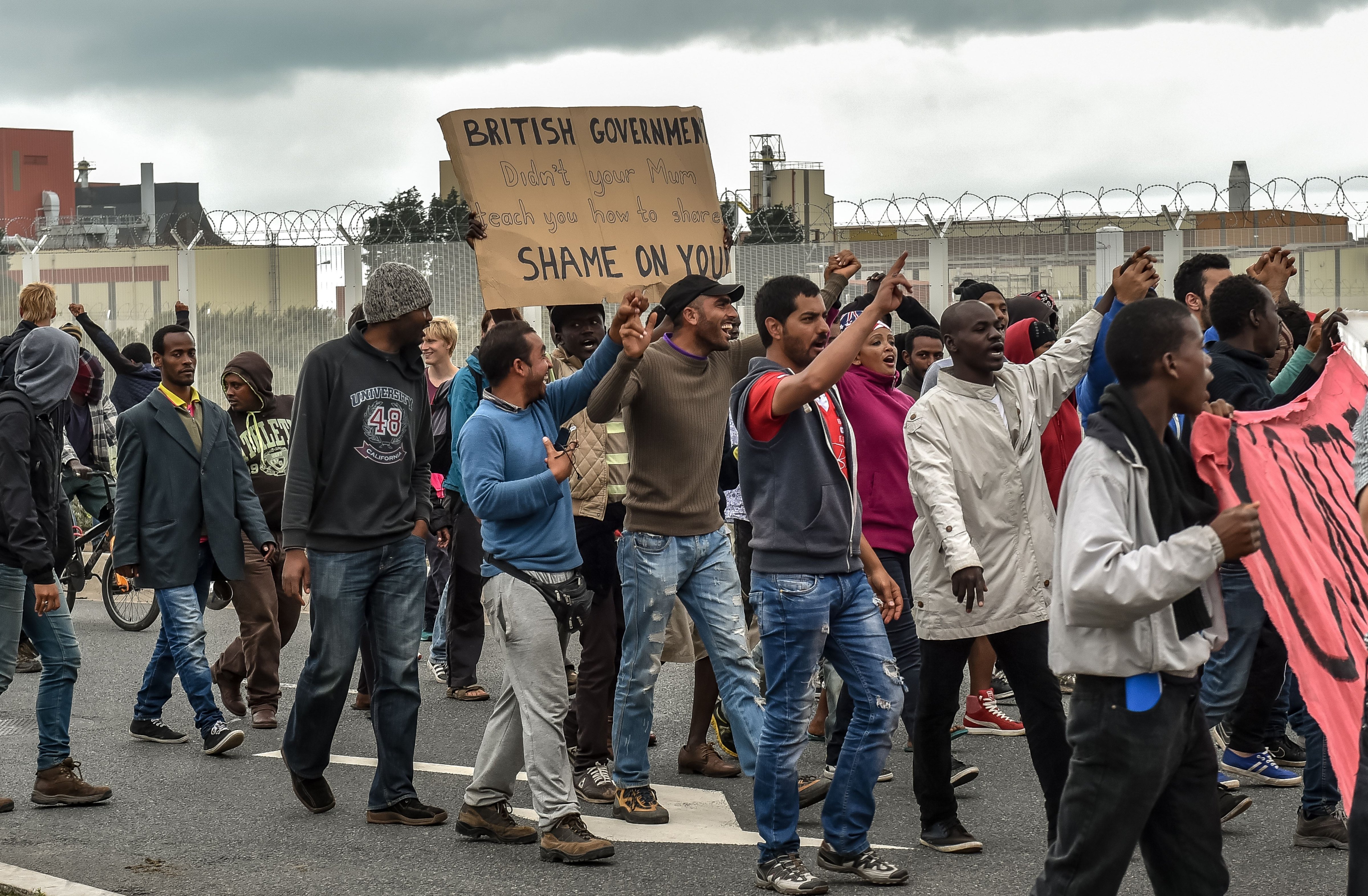Illegal migrants demonstrate against British government, on Aug. 20, 2015 in Calais, (Philippe Huguen—AFP/Getty Images)