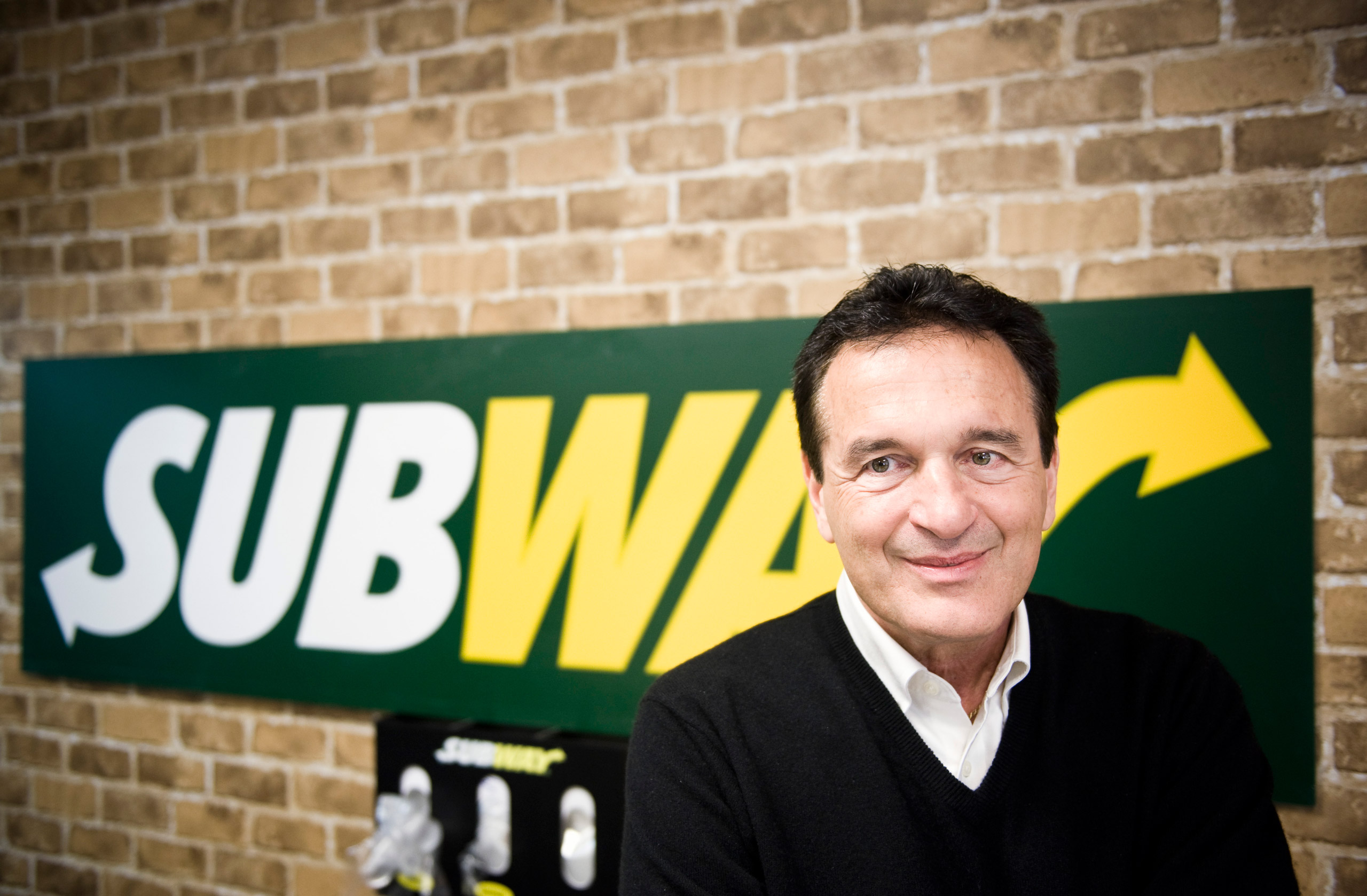 Fred DeLuca, President and founder of sandwich maker Subway, smiles during an interview in a Subway restaurant at "Solna Centrum" in Stockholm on March 10, 2011.  The self-made billionaire who heads up sandwich maker Subway, now the world's largest fast food chain in terms of restaurants, never thought his operation would become bigger than McDonald's.   "It was just a way to pay my way through college," Fred DeLuca, who started his business at age 17, told AFP at a newly opened restaurant in Stockholm on March 10.  AFP PHOTO/JONATHAN NACKSTRAND (Photo credit should read JONATHAN NACKSTRAND/AFP/Getty Images)